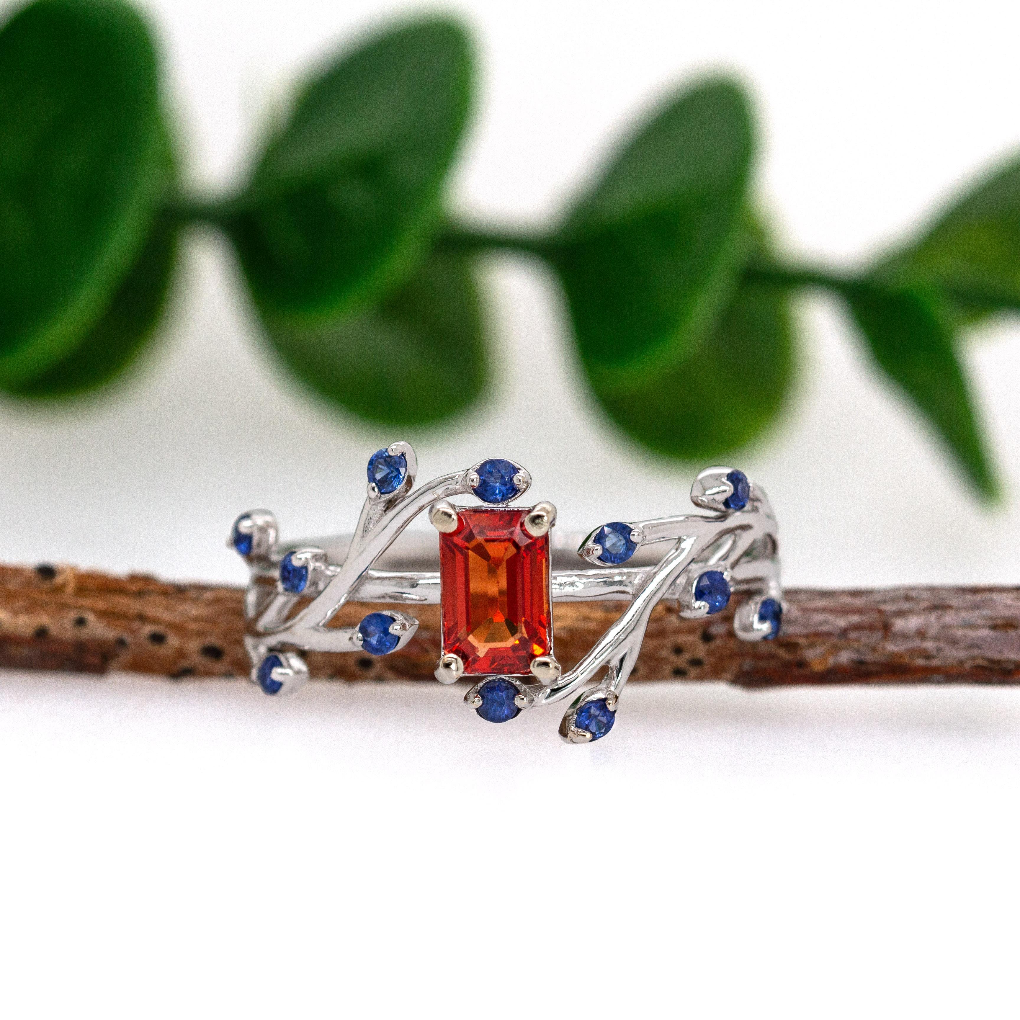 Contemporary Orange Sapphire Ring with Blue Sapphire Accents in Solid 14K Gold  EM 6x4mm For Sale