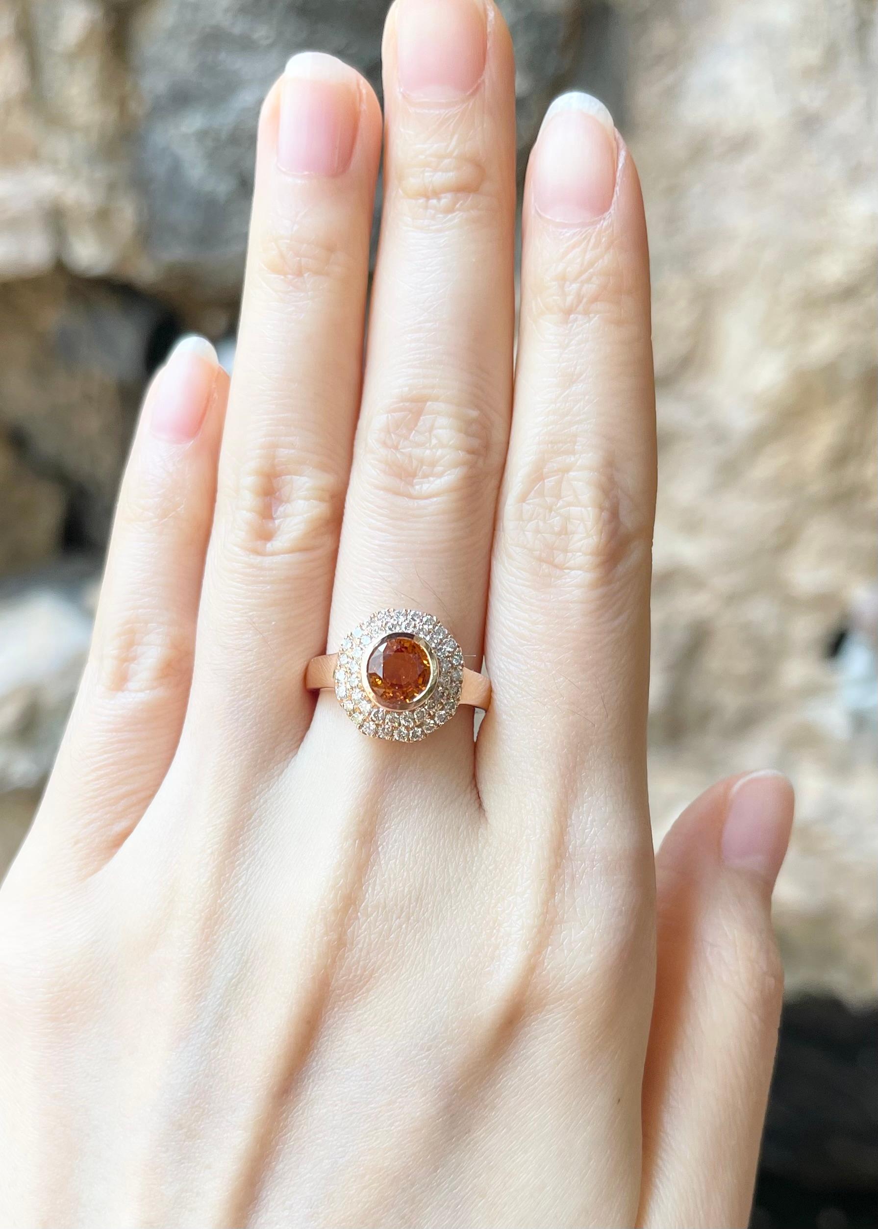 Orange Sapphire 1.76 carats with Brown Diamond 0.56 carat Ring set in 18K Rose Gold Settings

Width:  1.4 cm 
Length: 1.4 cm
Ring Size: 53
Total Weight: 7.79 grams


