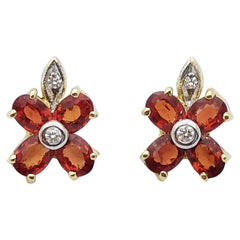 Orange Sapphire with Diamond Earrings Set in 14 Karat Gold Settings