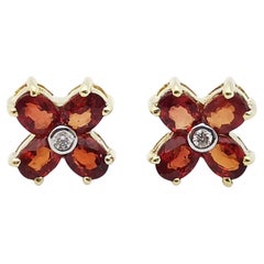 Boucles d'oreilles en saphir orange et diamants sertis en or 14 carats