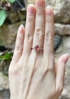 Orange Sapphire with Diamond Ring set in 18K Gold Settings