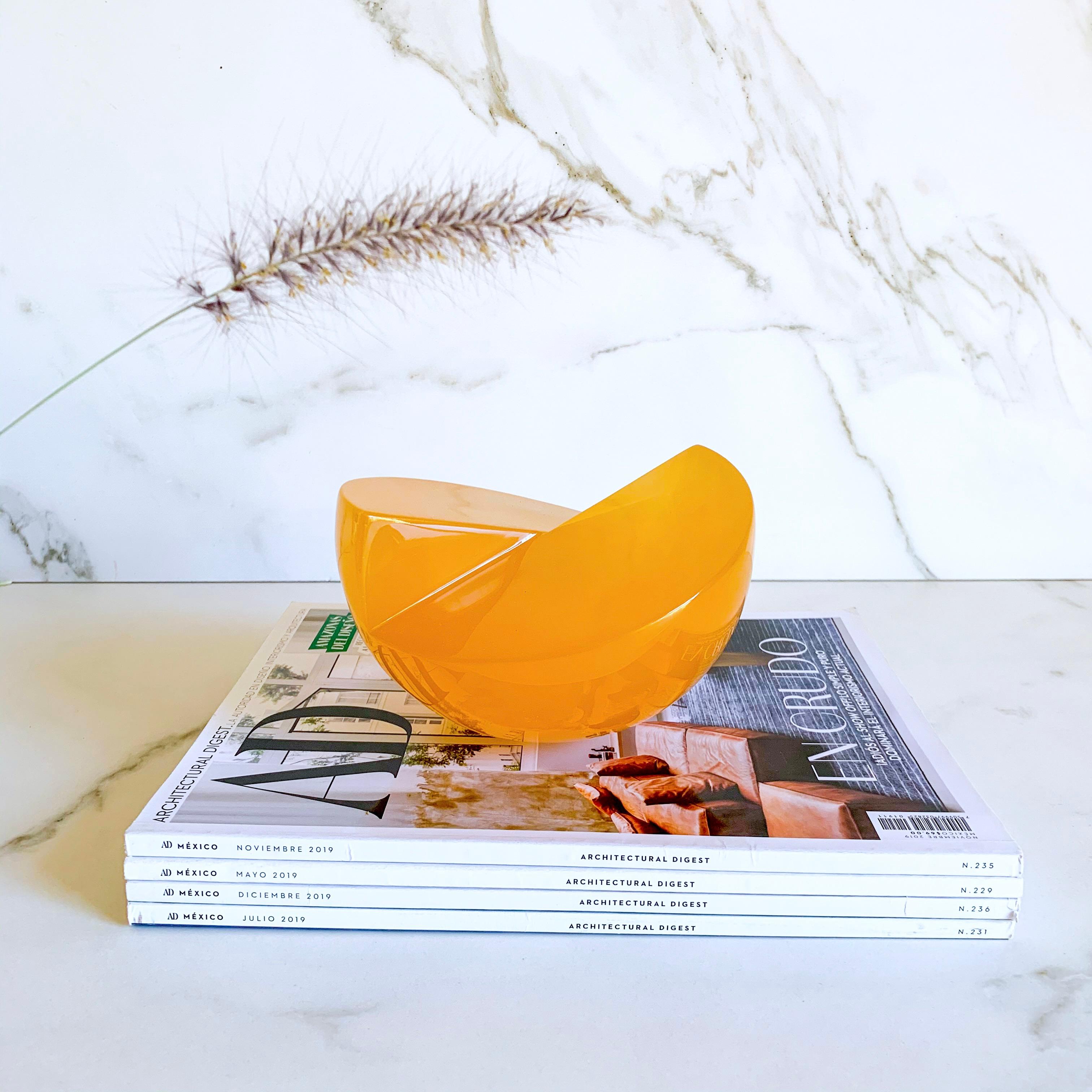 This Geometric sculpture is handmade in polished resin in a variety of colors. It is a modern and colorful piece that will liven up any space.

Our Semi Sphere is a very cool and fun piece! It can be transformed into a complete sphere when you