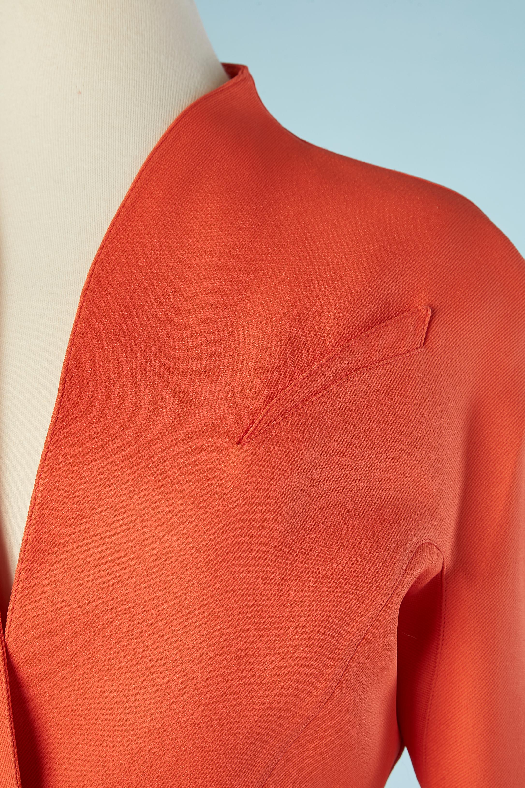 Orange  single-breasted jacket with 3 snaps in the middle front.Fabric composition: 53% acetate, 47% rayon.  Silk lining. 
Cut-work. 
SIZE 38 (Fr) 8 (Us)