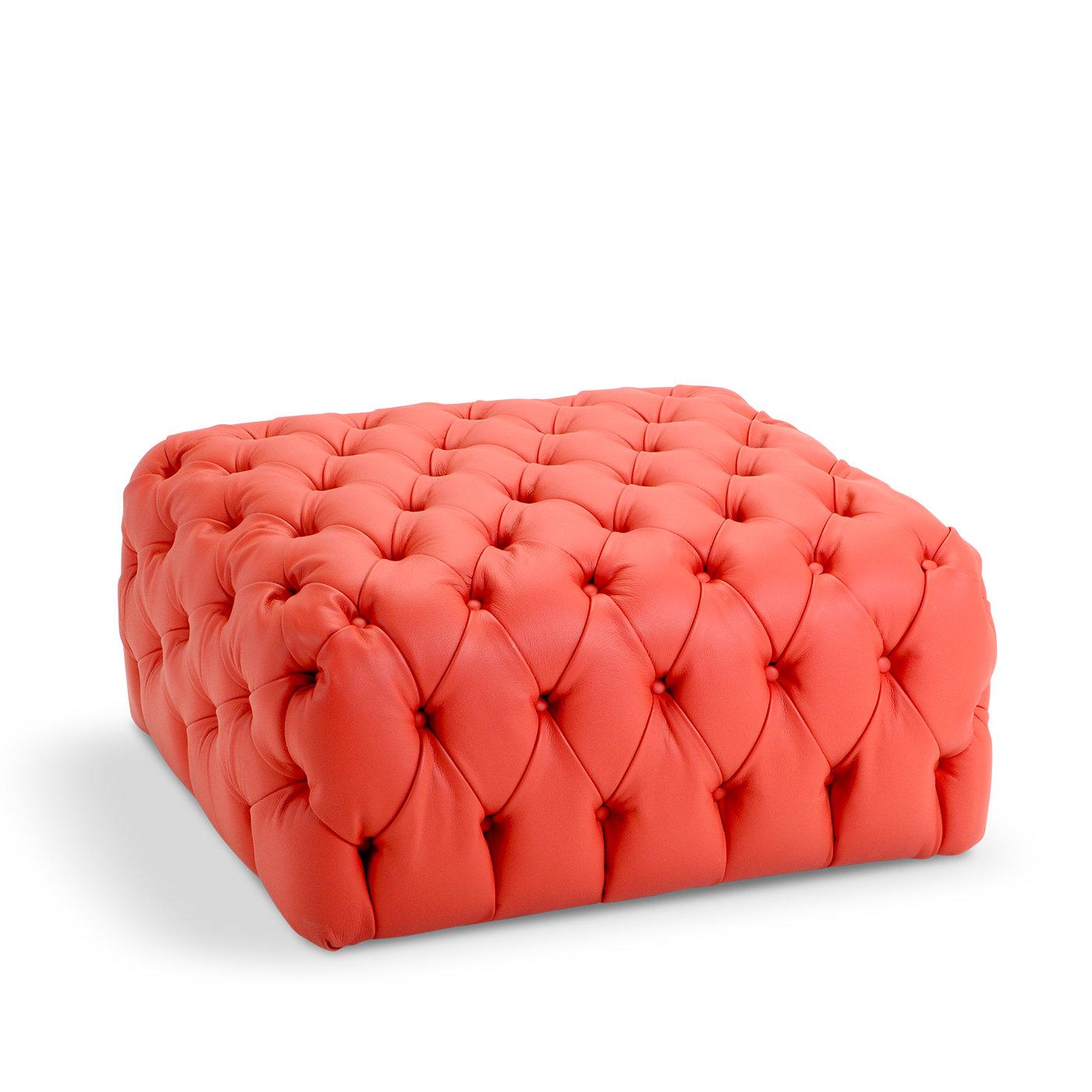 Exuding elegance and comfort, this pouf makes a glamorous statement piece in a classic-styled living room, lounge, or walk-in closet. The plywood and fir frame, padded in multi-density polyurethane foam, is covered with vibrant orange dacron with