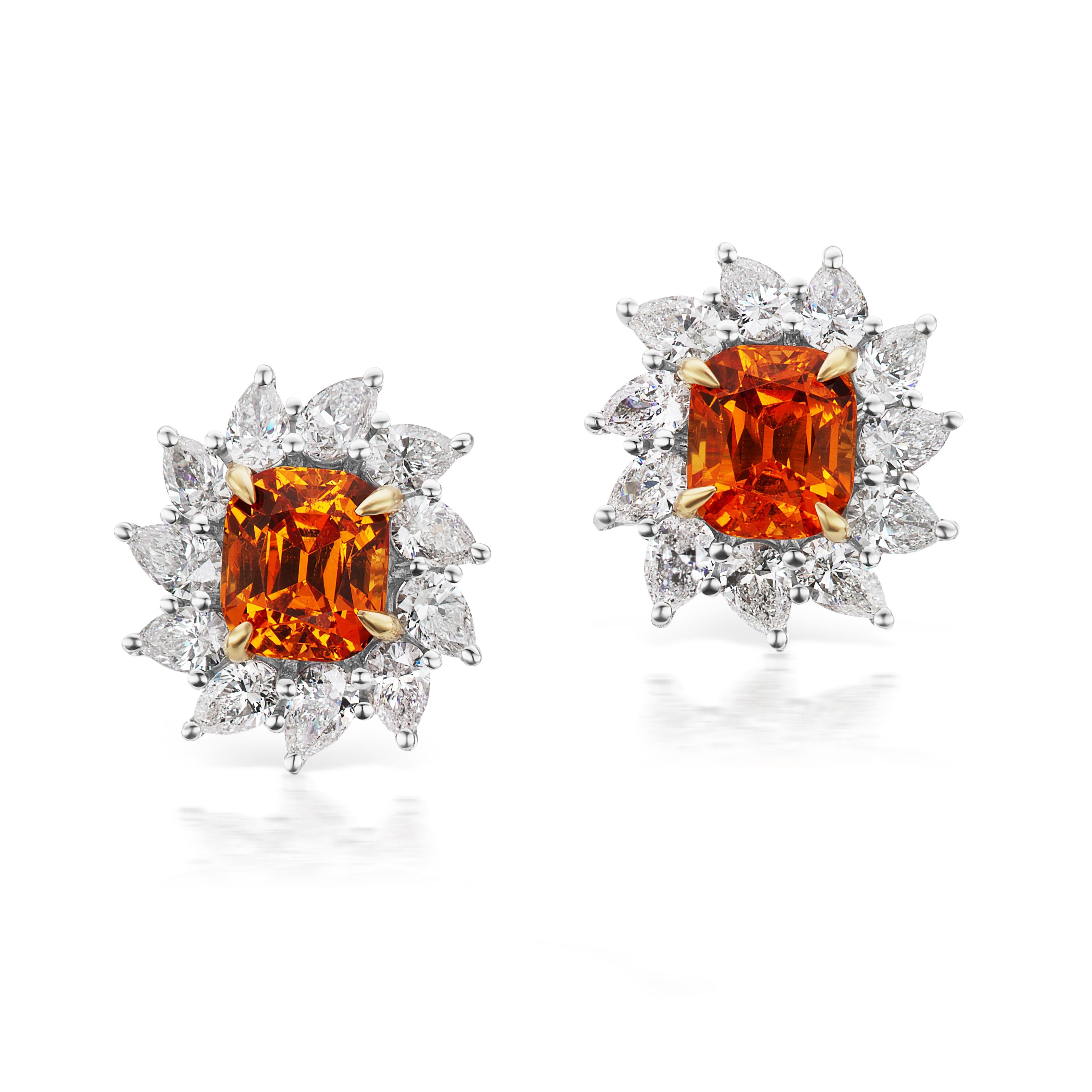 Phoenix Crown Earrings:
These earrings dance like a flame with a sexy fringe of gems. Wear them 3 ways for a day to night look.

The Design:
These dramatic earrings play with fire: flame colored spessartite garnets and orange sapphires glow with
