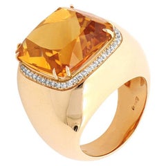 orange spinel and white diamonds ring