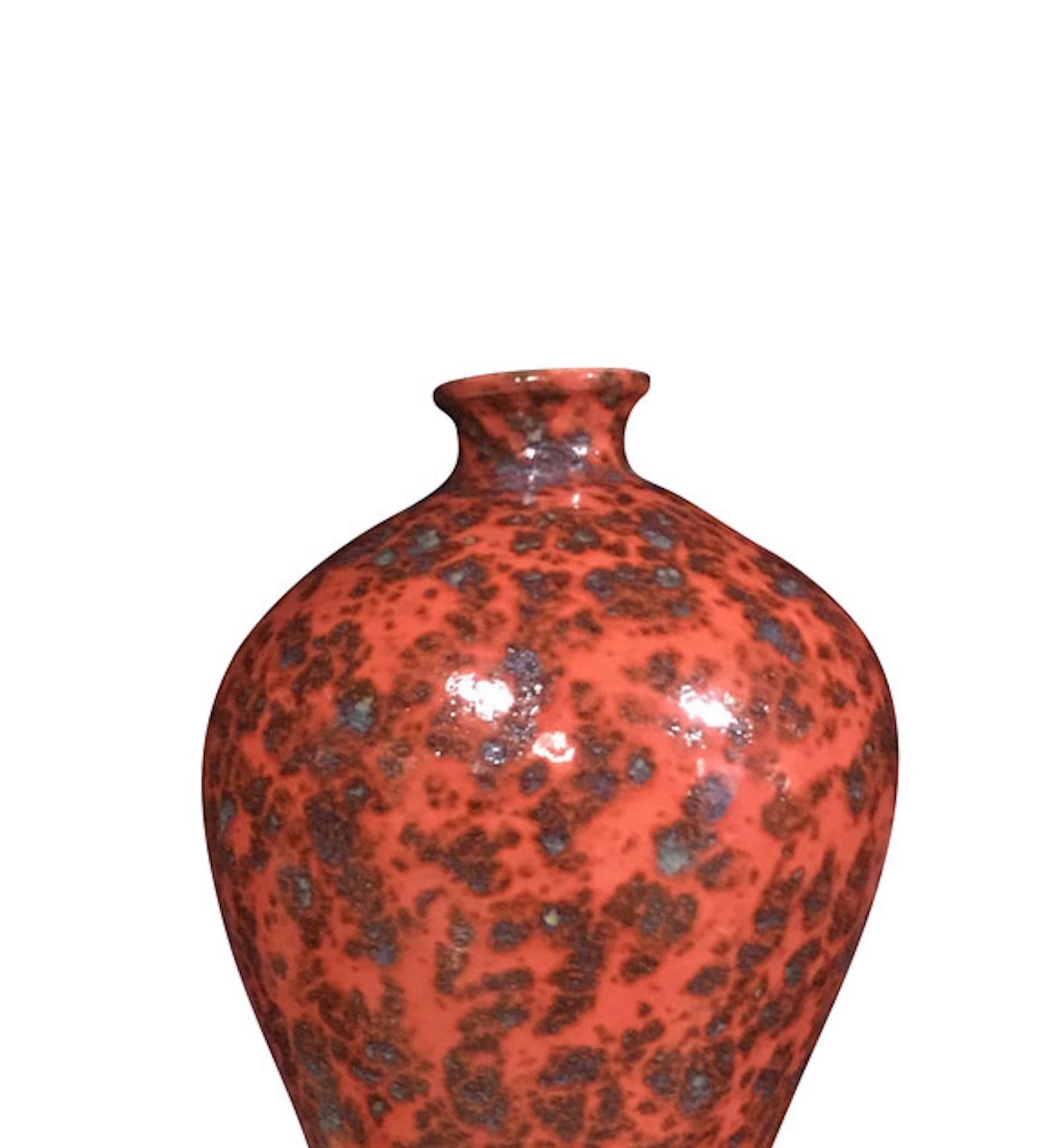 Contemporary Chinese orange splattered glaze porcelain vase.
Narrow opening.
