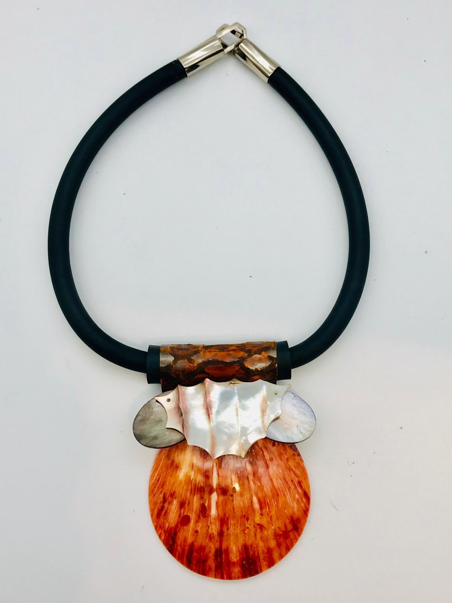 
 Orange Spondylus  eco–luxe Pendant. This shell's habitat is in the tropical west Pacific. It is harvested wild and also grown on sustainable food farms. In ancient times Incas nobility and priests used to wear these shells during ceremonial