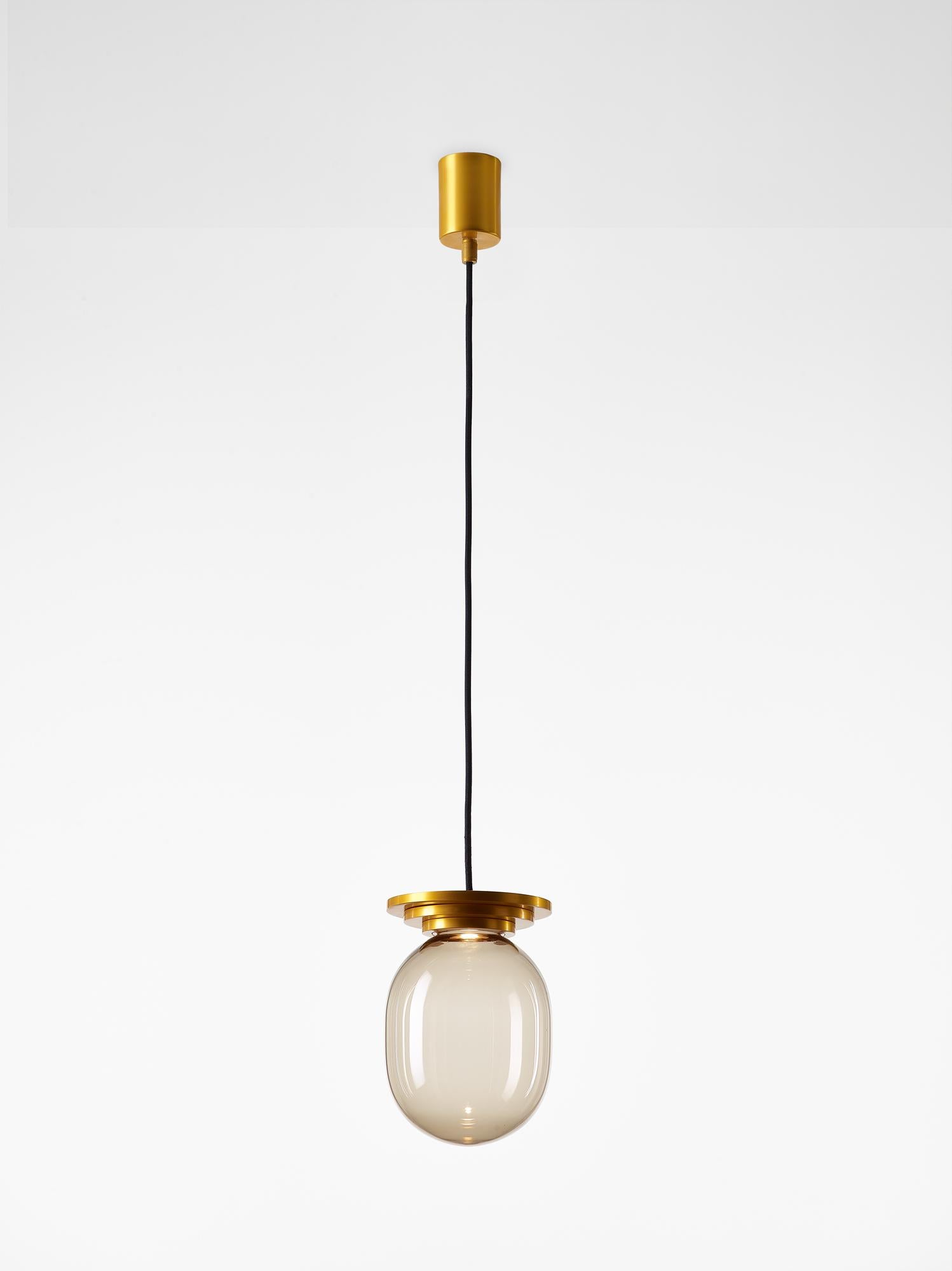 Orange Stratos big capsule pendant light by Dechem Studio
Dimensions: D 20 x H 28 cm
Materials: Aluminum, glass.
Also available: Different colours available

Different shapes of capsules and spheres contrast with anodized alloy fixtures,