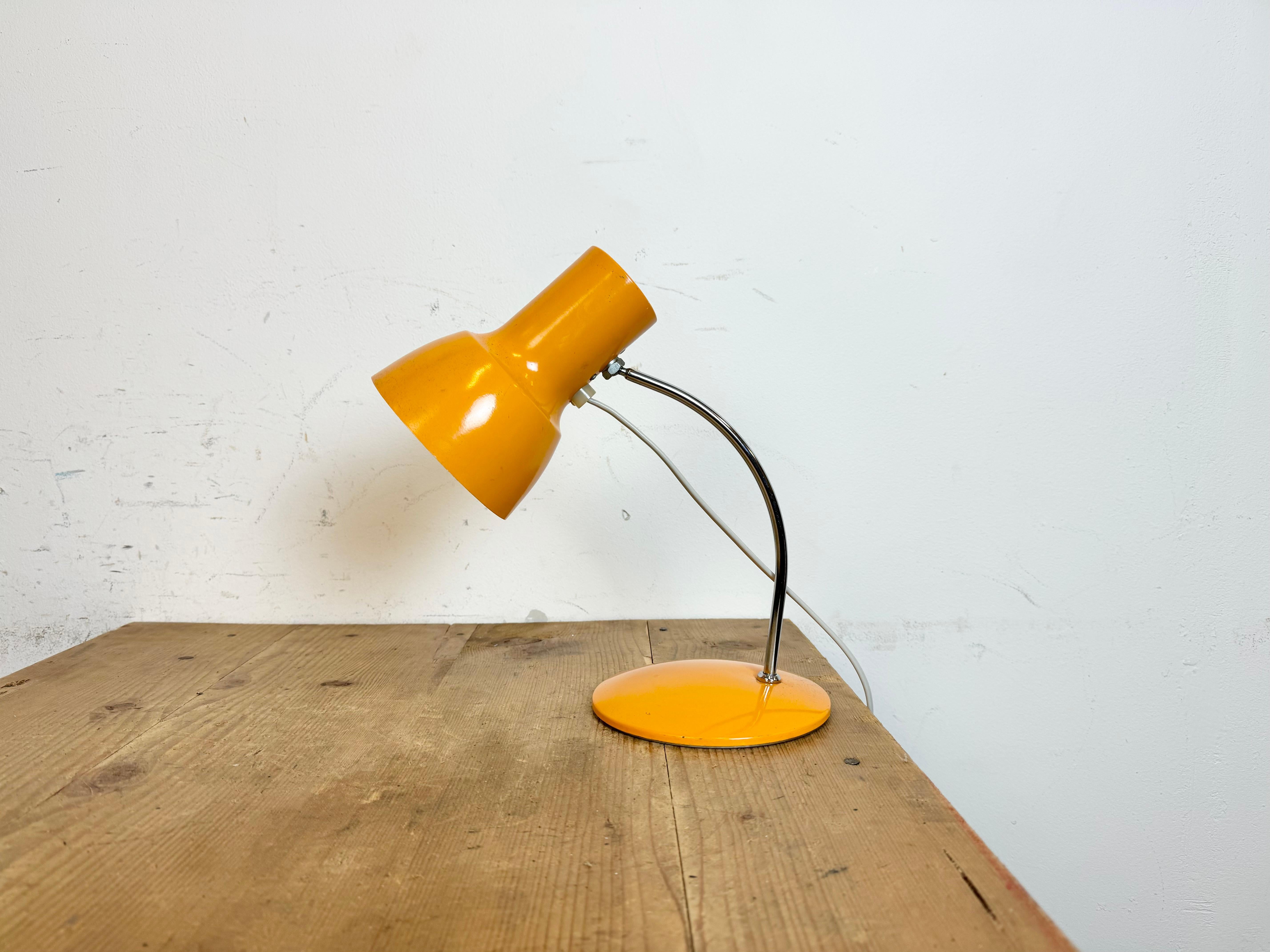 Vintage table lamp designed by Josef Hurka and produced by Napako in former Czechoslovakia during the 1970s.It features an aluminium shade and chrome plated arm with iron base.The original socket requires E 14 light bulbs.The diameter of the shade