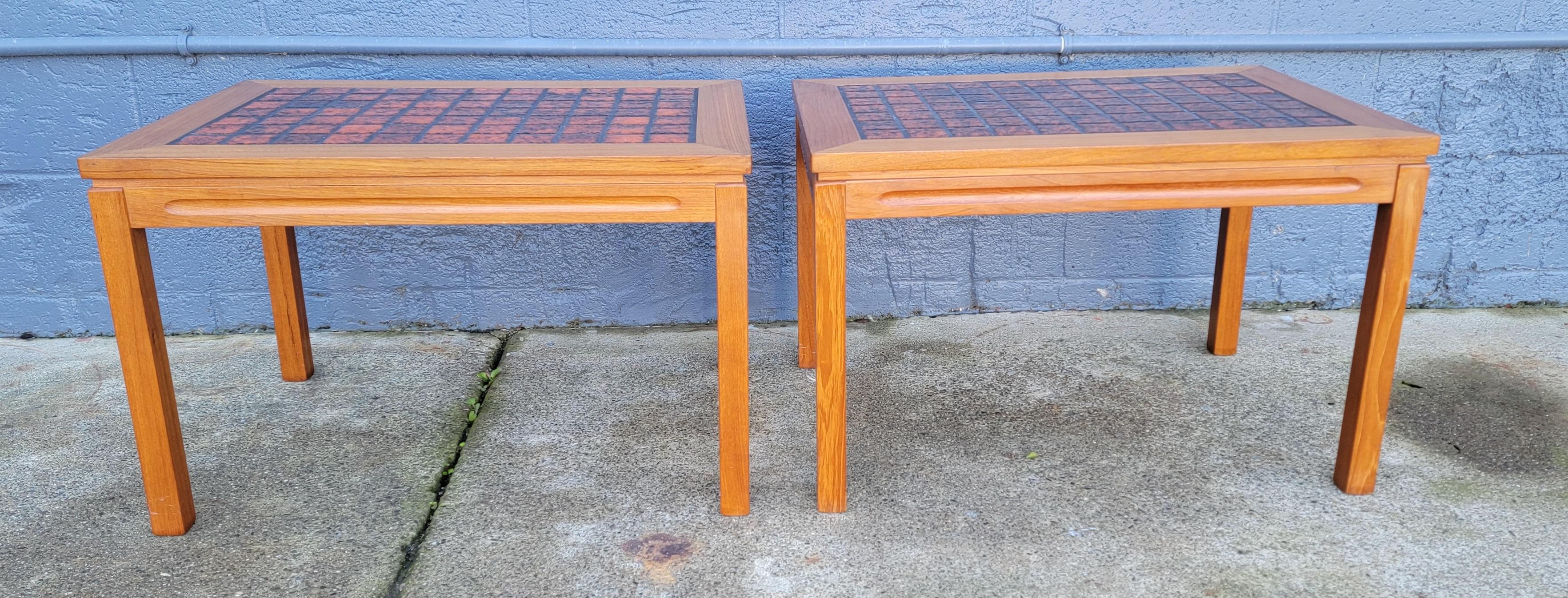 Vibrant pair of Danish Modern teak side or end tables with burnt orange 