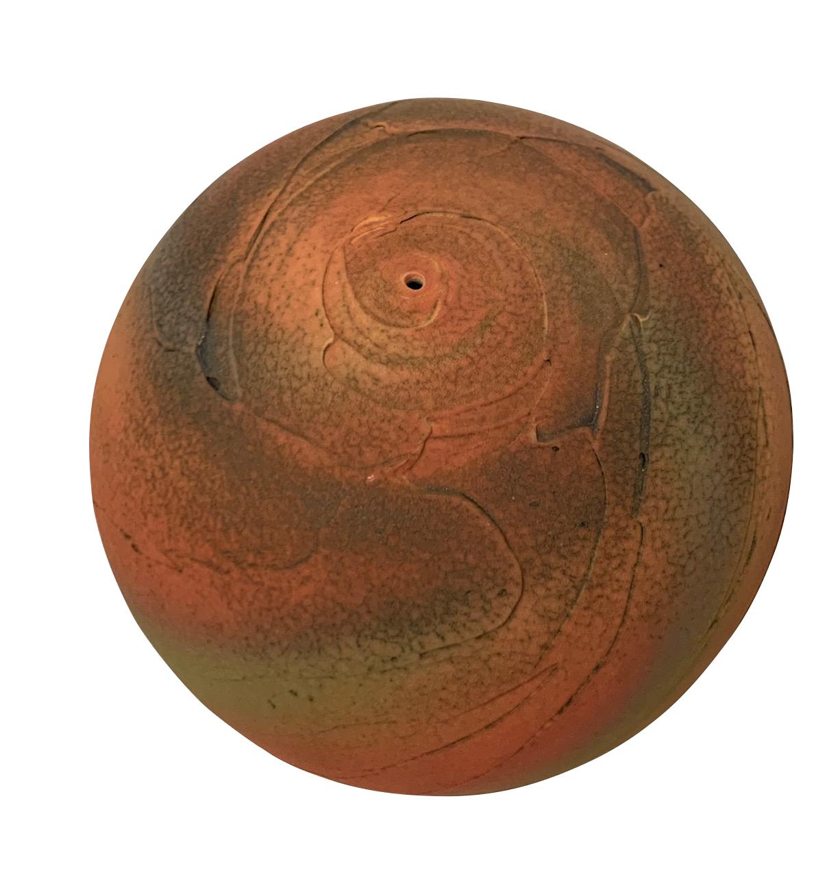 Contemporary textured round ceramic earthenware vase.
Classical shape textural design vase inspired by the landscape. 
Bright bottle orange in spiral bands with a shot of green.
The vase design has an ancient feel.
Hand made one of a kind.
Part