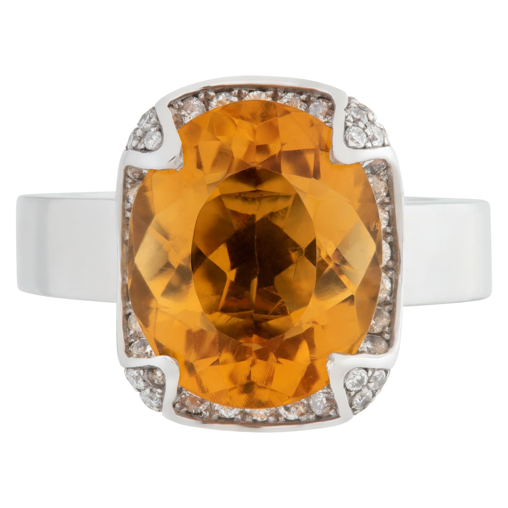 Outstanding oval cut orange topaz ring with diamond claw setting in 18k white gold. Size 5.5. Top of ring measures 12mm x 14.5mm.This Diamond ring is currently size 5.5 and some items can be sized up or down, please ask! It weighs 9.3 pennyweights