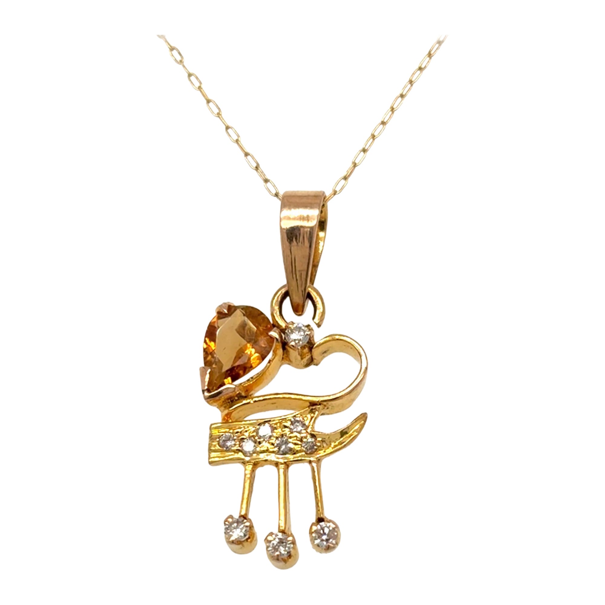 Collier à pendentif en or jaune avec tourmaline orange et diamant en vente