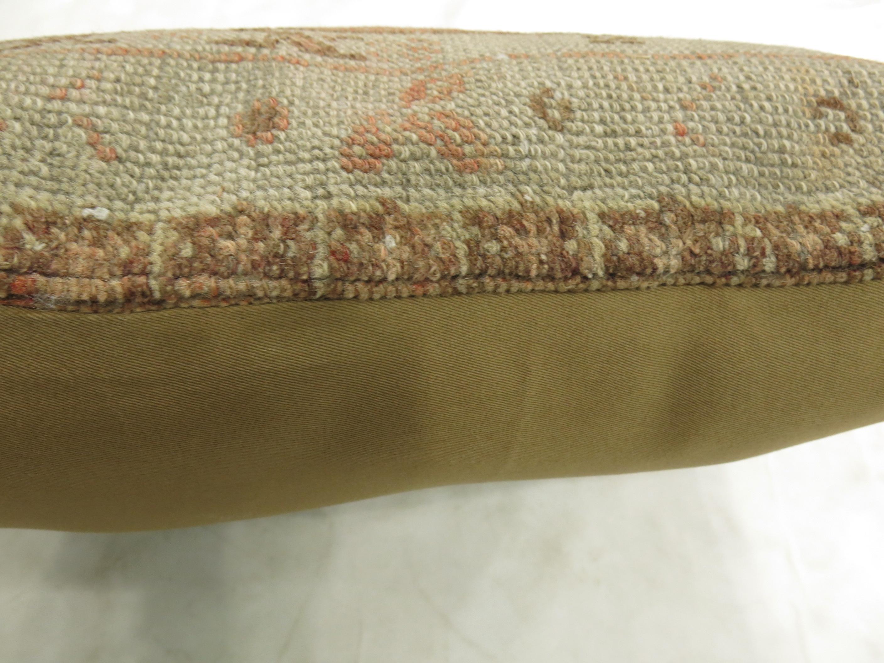 Large pillow made from a 20th century Turkish Oushak rug in an orange peel tone.

Measures: 16'' x 24''.