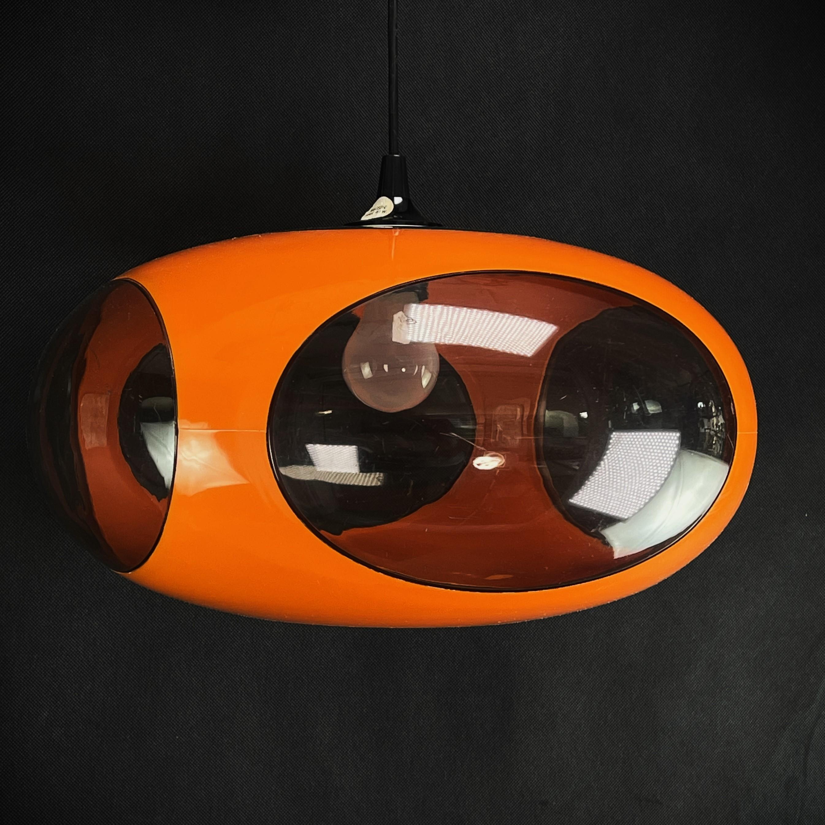 Orange UFO ceiling lamp from Massive Belgium - 1970s.

The beautiful and rare lamp is a real design Classic from the 70s. This lamp in an extraordinary design is a highlight for every lounge interior of the Panton-Eames era. This extraordinary