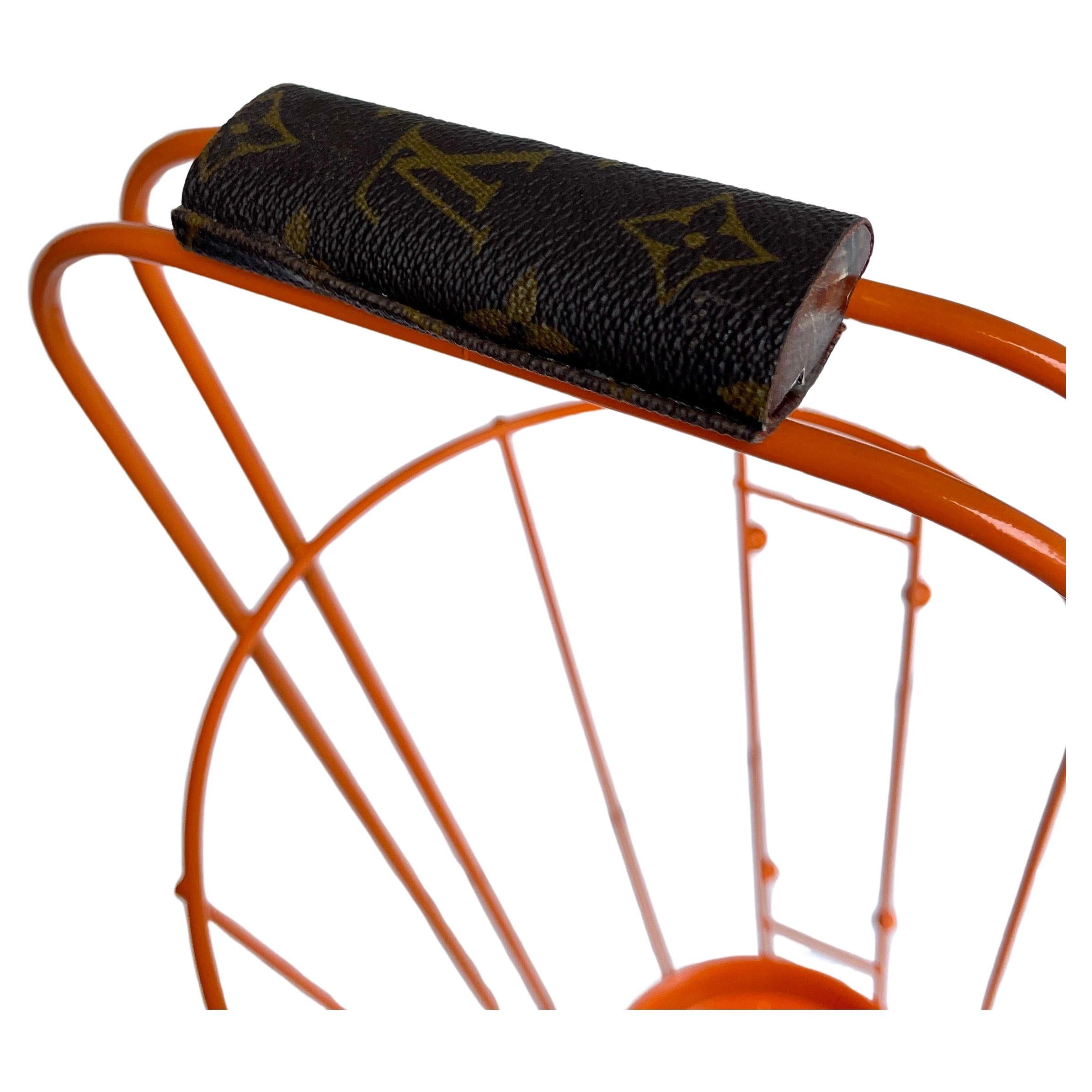 Mid-Century Modern Powder-Coated in Orange Umbrella Stand Holder

This umbrella stand is newly powder-coated in what we call Hermes Orange color. There is great detail on this metal lightweight piece with custom Louis Vuitton Monogram leather
