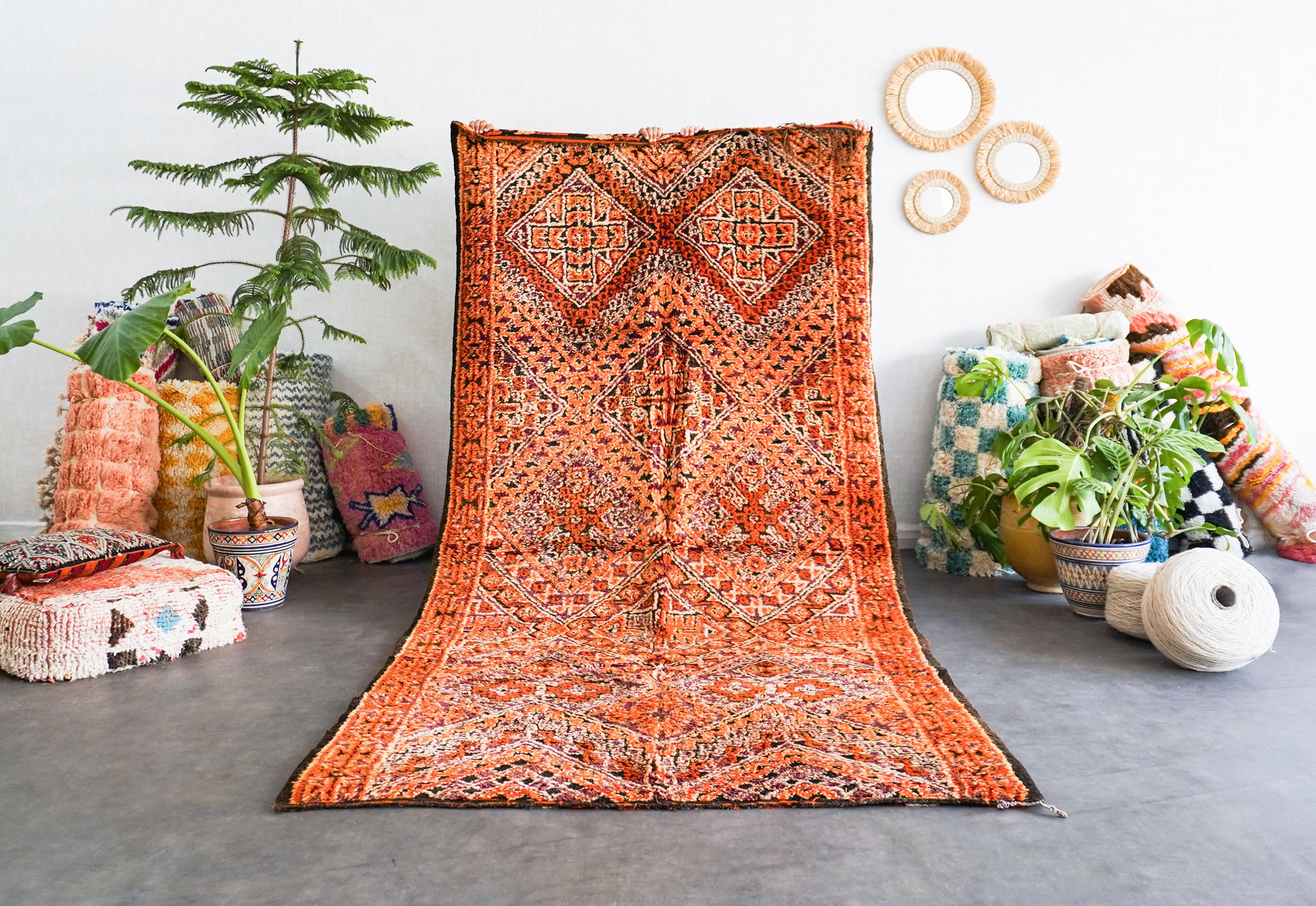 Uncover the rich heritage woven into our orange Moroccan vintage rug. Handmade by skilled artisans using time-tested techniques, each Berber rug is a unique narrative, echoing the cultural tapestry of Morocco. With intricate geometric patterns and a