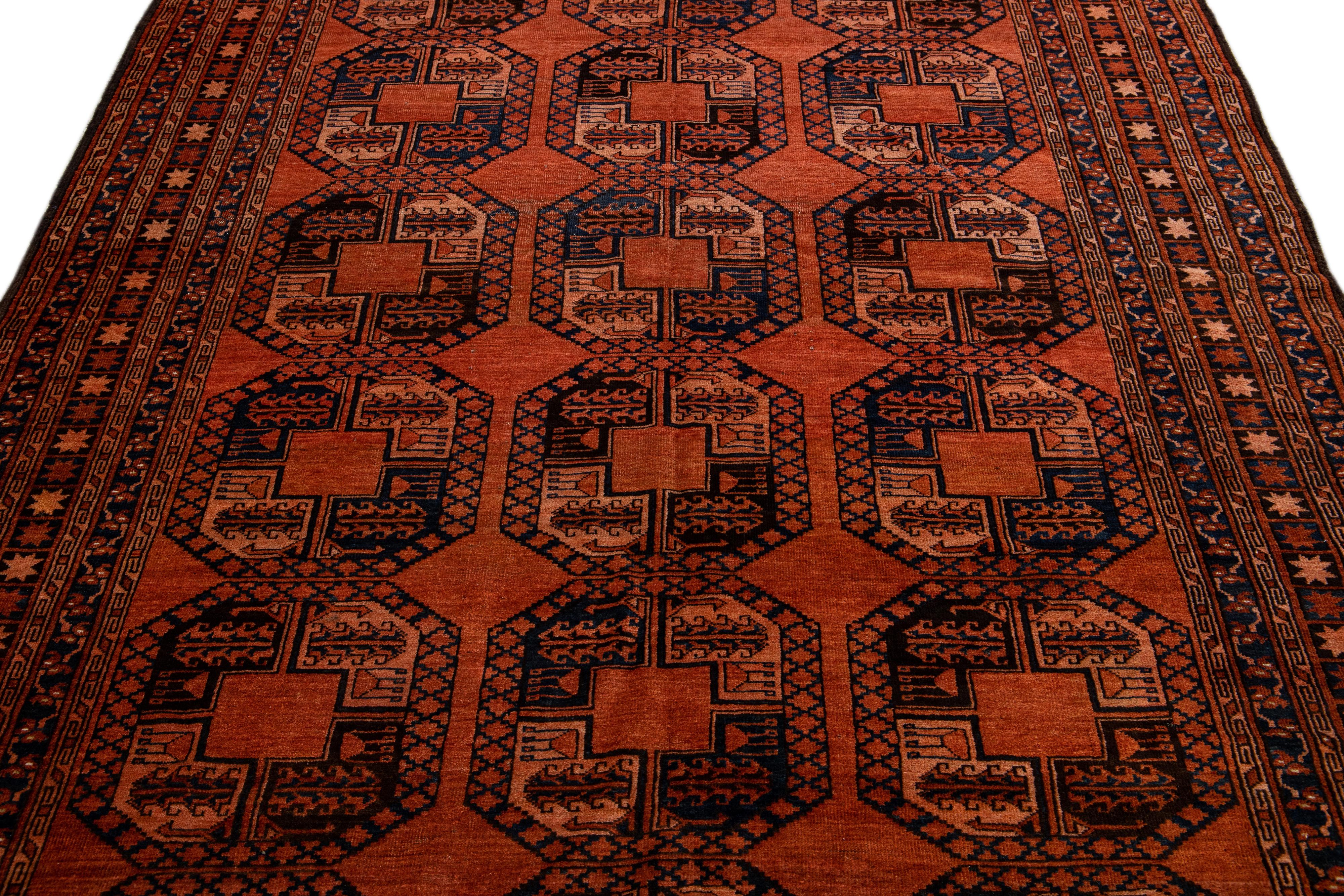 Islamic Orange Vintage Persian Turkmen Handmade Geometric Pattern Wool Rug For Sale