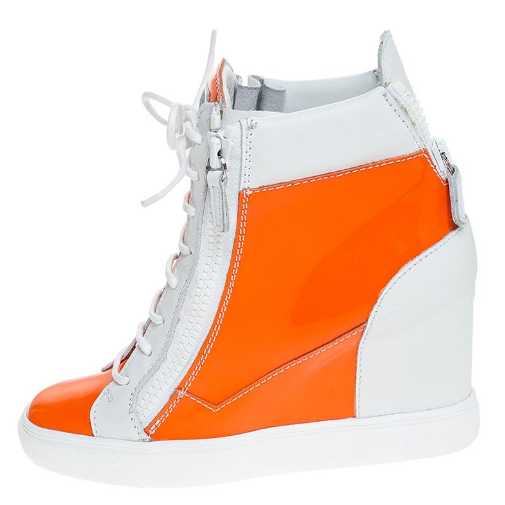 Comfort comes wrapped in these sneakers from Giuseppe Zanotti. They are crafted from leather and they bring details of lace-ups and zippers. Elevated on wedge heels, these sneakers are easy to wear all day without compromising on style.

Includes: