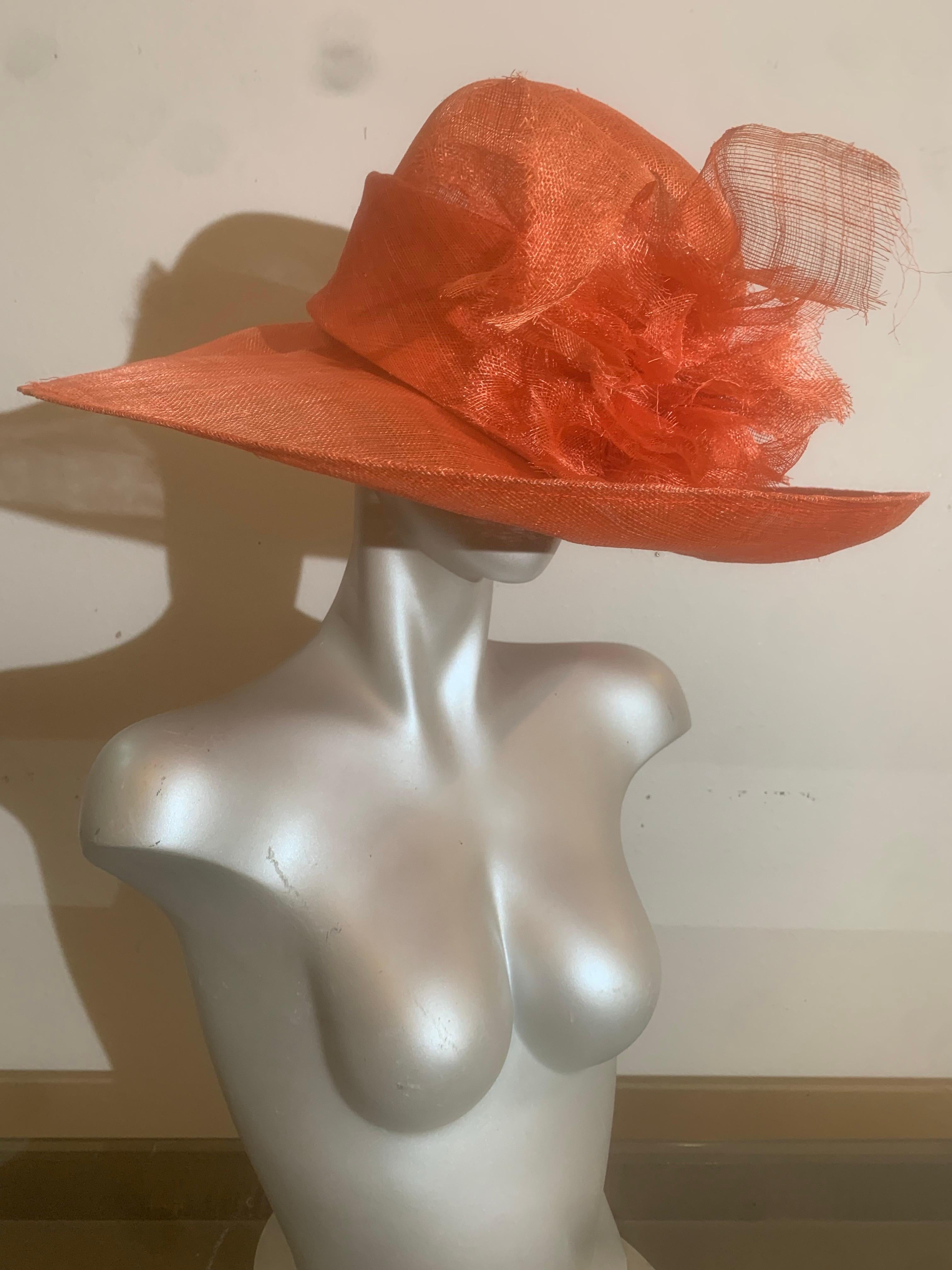 Orange Wide Brim Couture Straw Hat w Round Crown. Wide Straw Band and Straw Floral Detail in Front: Suzanne Couture Millinery produced this Spring/Summer collection, ultra-fine sheer straw hat. Brim is 20