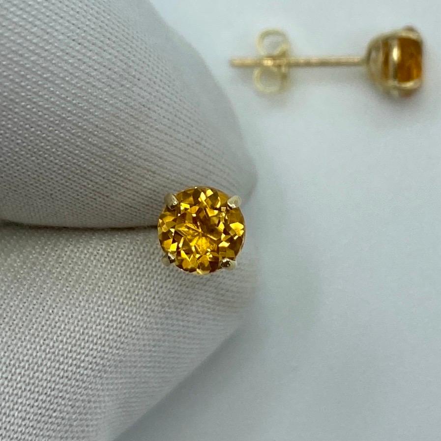 Orange-Yellow Champagne 1.15 Carat Topaz Yellow Gold Earring Studs.

Beautiful 5mm matching pair of round topaz with a vivid orange-yellow champagne colour, excellent clarity and an excellent round brilliant cut.

Set in lightweight 9k yellow gold