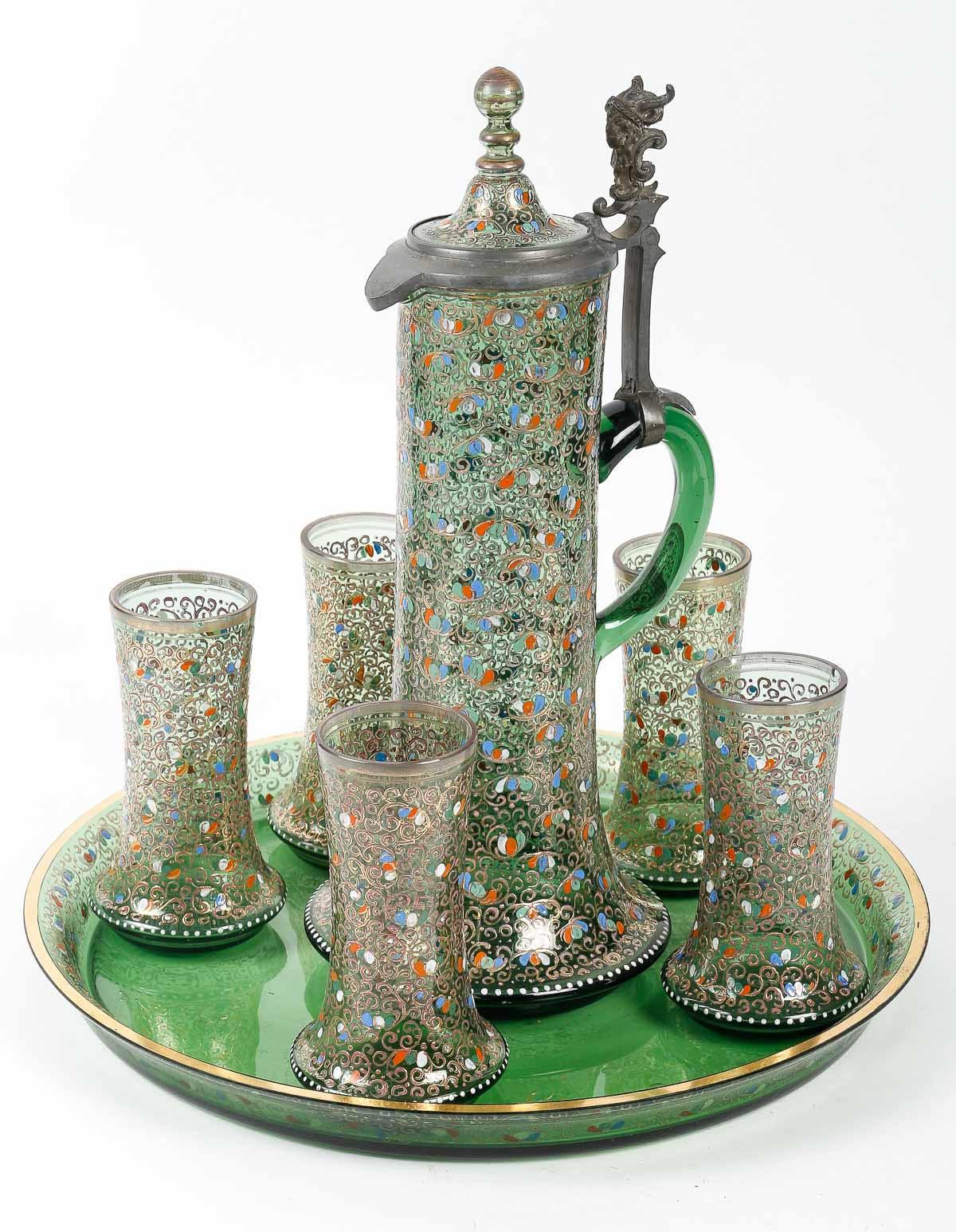 Orangeade service in enamelled Moser crystal, 19th century.

Enamelled Moser crystal orangeade service, the decanter mounted in pewter, (5 glasses, the tray and the decanter), 19th Century, Napoleon III period, slight chips to two