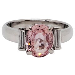 Orangy Pink Sapphire Oval and White Diamond 3-Stone Ring in Platinum