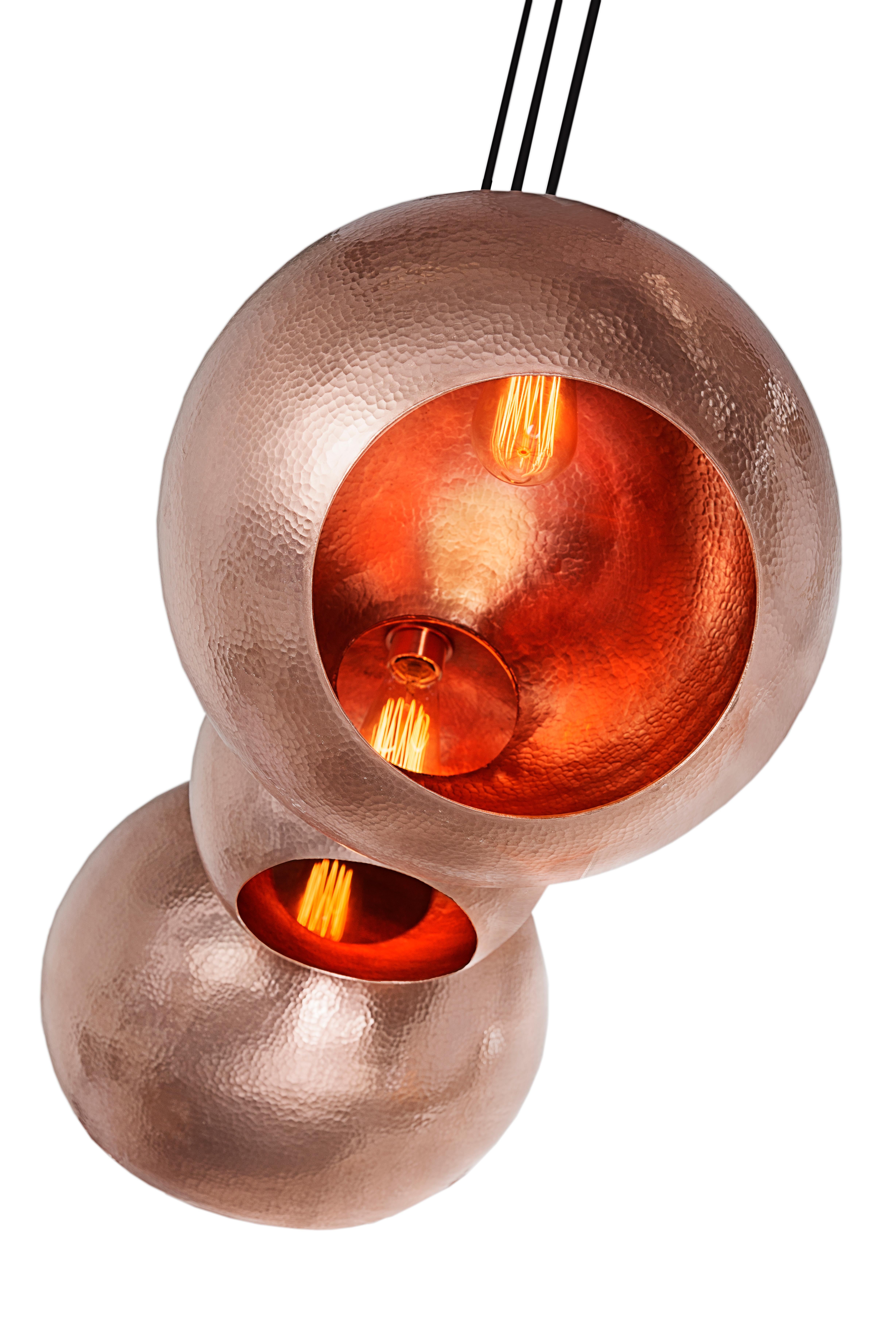 The Alquimia Orb: Berth by Luminosa is a handmade solid copper pendant chandelier designed for the modern interior. Polished copper on the inside and outside (see below for more contemporary patinas). The Orb: Birth looks amazing in any contemporary