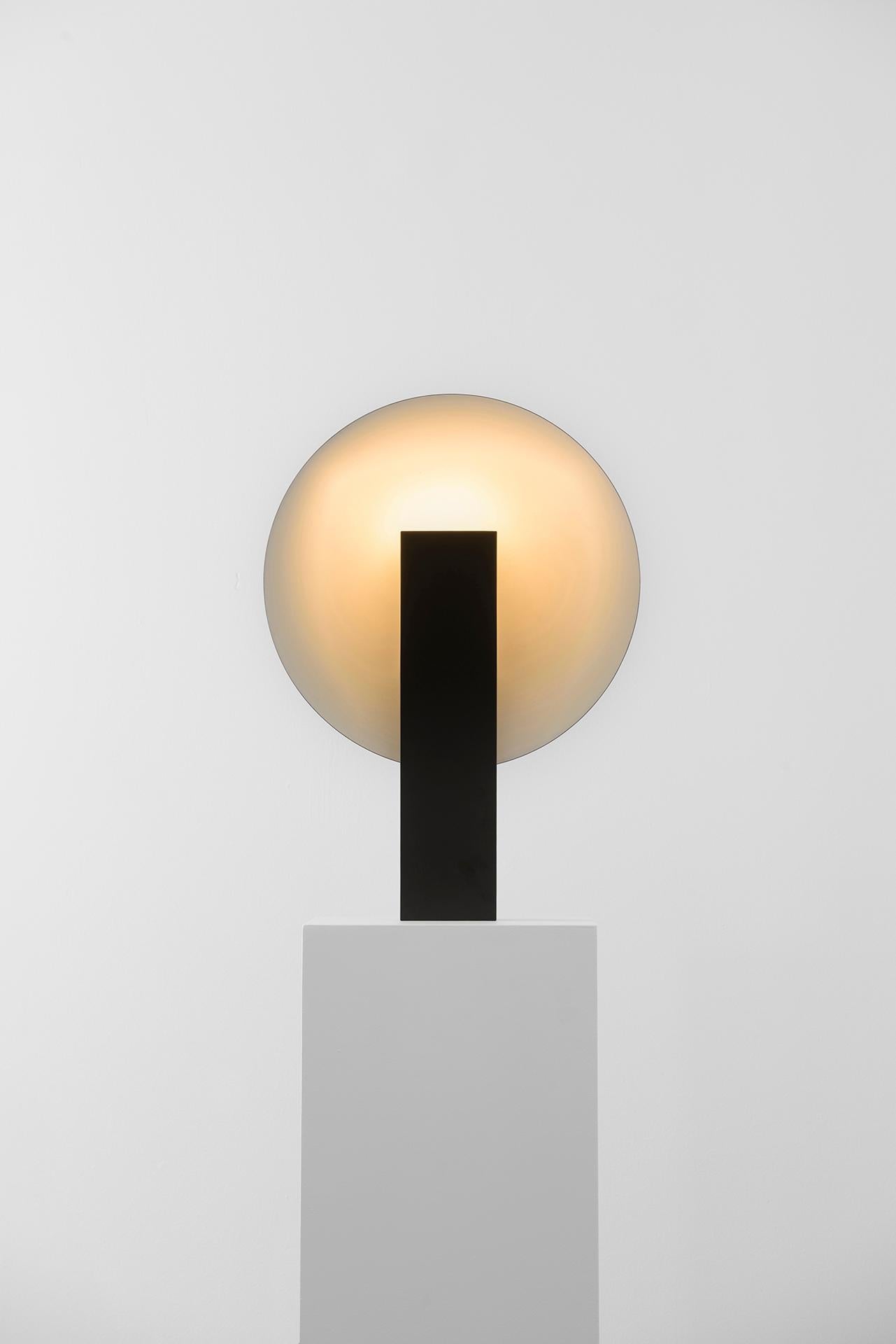 ORBE is a table lamp with indirect light, designed to provide soft illumination to the environment.

The piece has a simple structure, composed by the minimum required for its functionality: the front box houses the light source and provides the