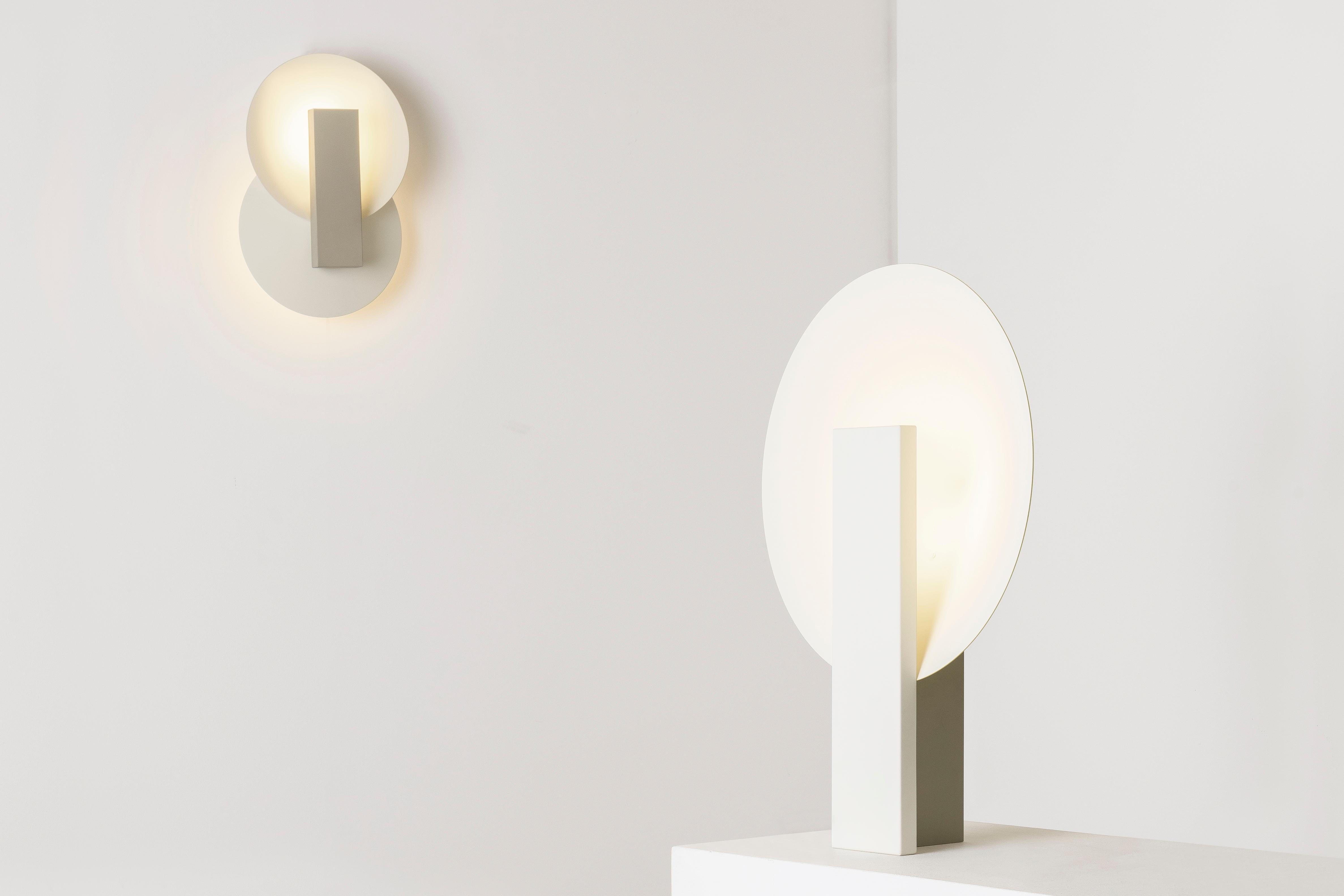 Orbe is a wall lamp with indirect light, designed to provide soft illumination to the environment.

The piece has a simple structure, composed by the minimum required for its functionality: the front box houses the light source and provides the