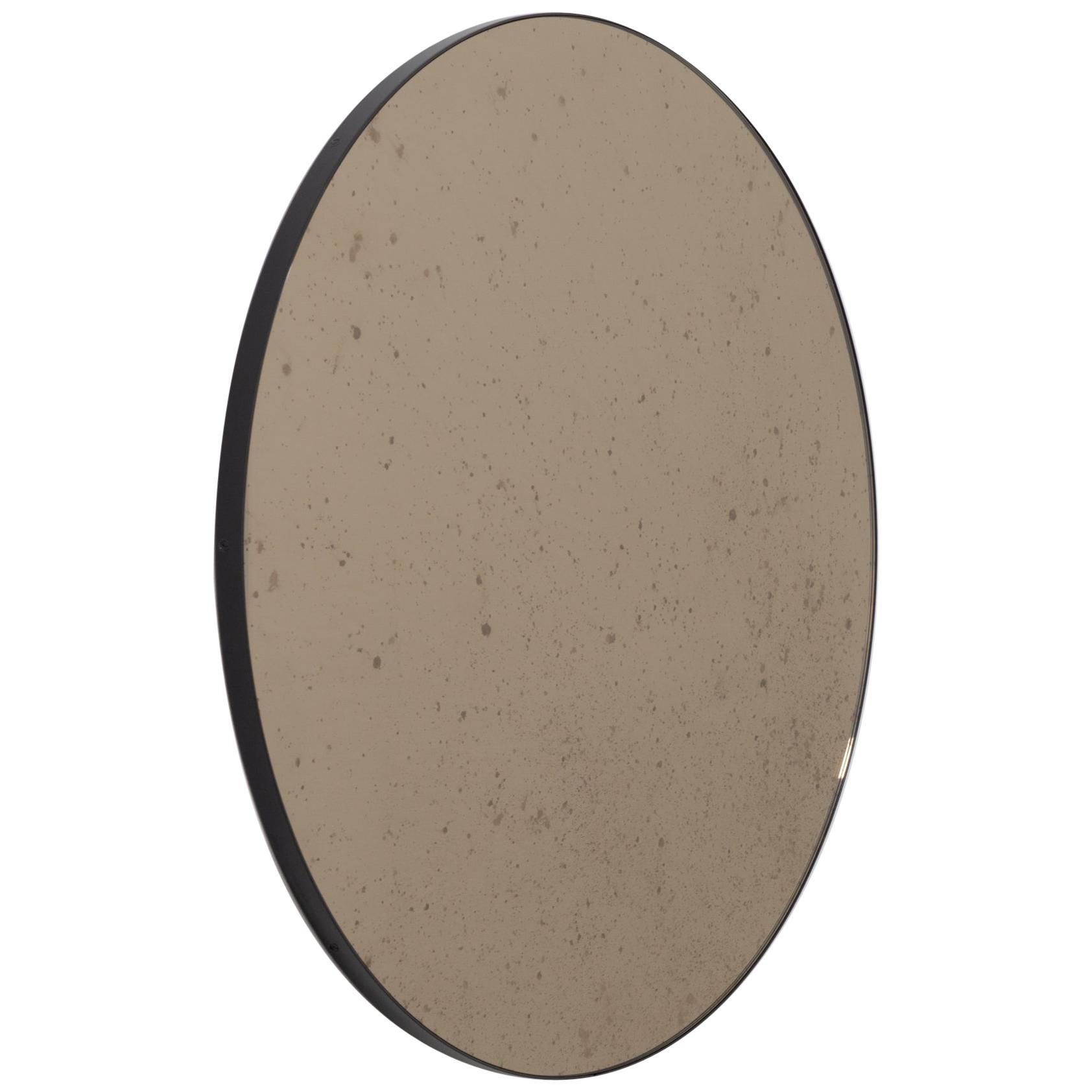 Orbis Antiqued Bronze Tinted Modern Round Mirror with a Black Frame, Regular For Sale