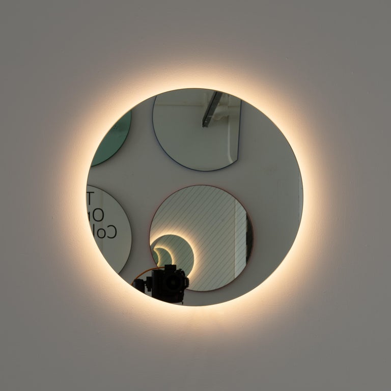 Contemporary back illuminated round frameless mirror with a floating effect. Quality design that ensures the mirror sits perfectly parallel to the wall. Designed and made in London, UK.

Fitted with professional plates not visible once installed