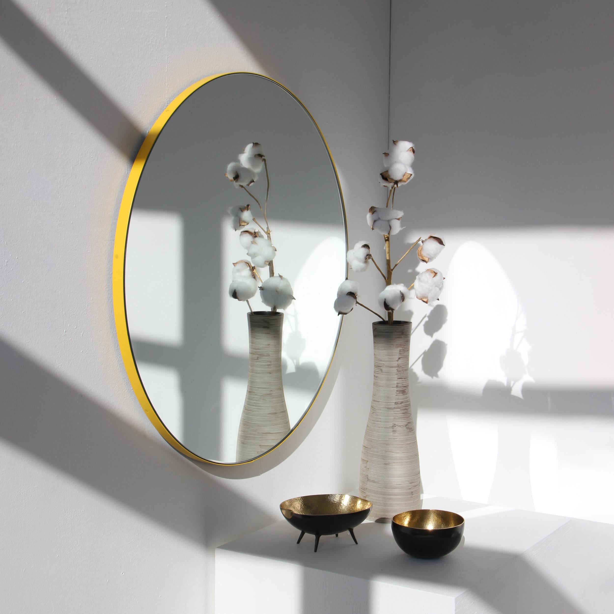 Modern round mirror with a vibrant yellow powder coated aluminium frame. Designed and handcrafted in London, UK.

Medium, large and extra-large mirrors (60, 80 and 100cm) are fitted with an ingenious French cleat (split batten) system so they may