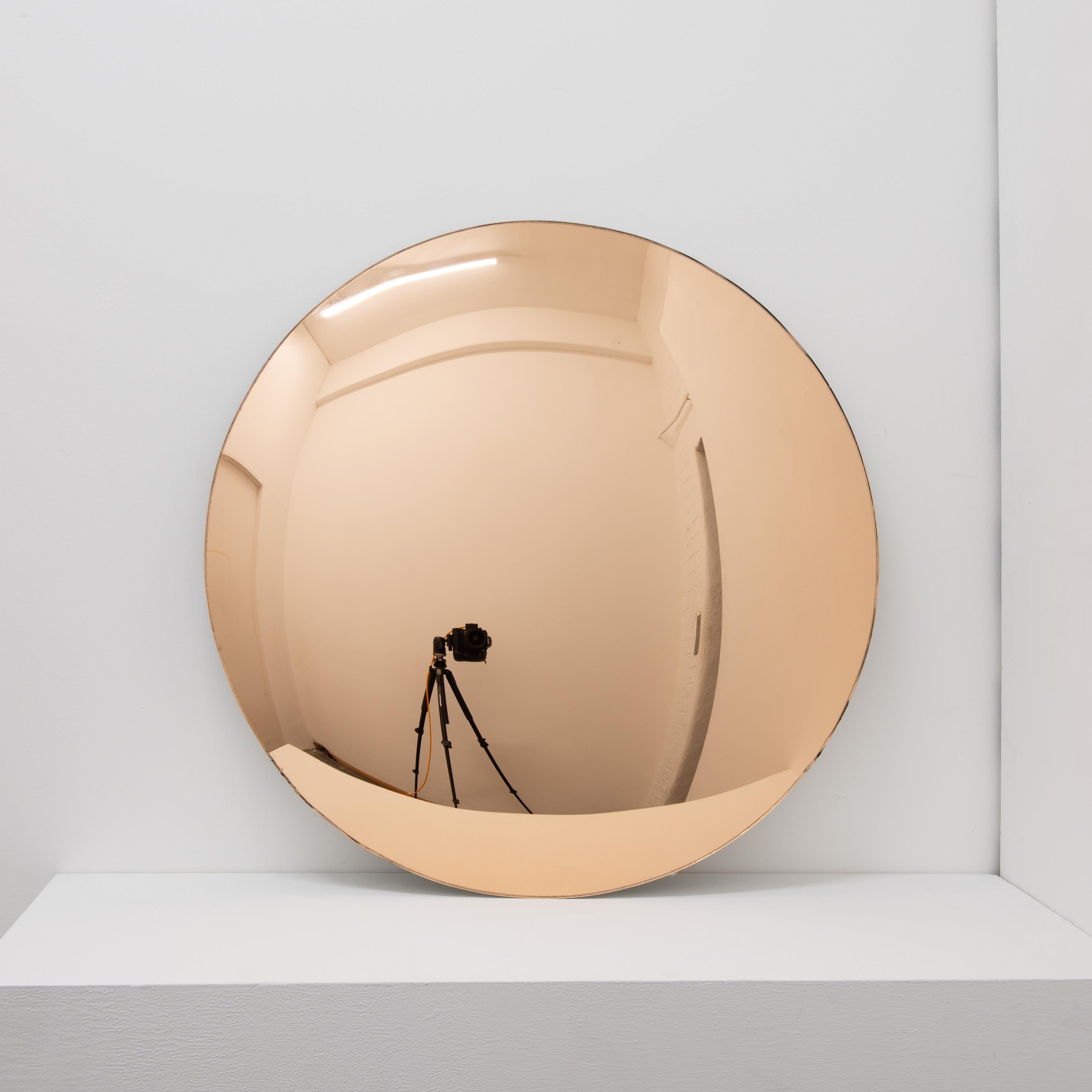 Stunning rose gold tinted convex frameless mirror.
Optional brass clips.

Each Orbis™ convex mirror is designed and handcrafted in London, UK. Slight variations in sizes and imperfections on edges and surface finishes are characteristics of such