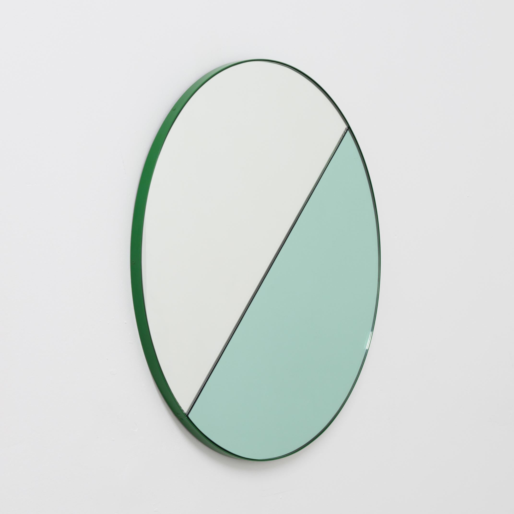 Delightful handcrafted mixed tinted (silver & green) Orbis Dualis mirror with a modern green frame. Designed and handcrafted in London, UK. The detailing and finish, including visible screws, emphasise the craft and quality feel of the mirror, a