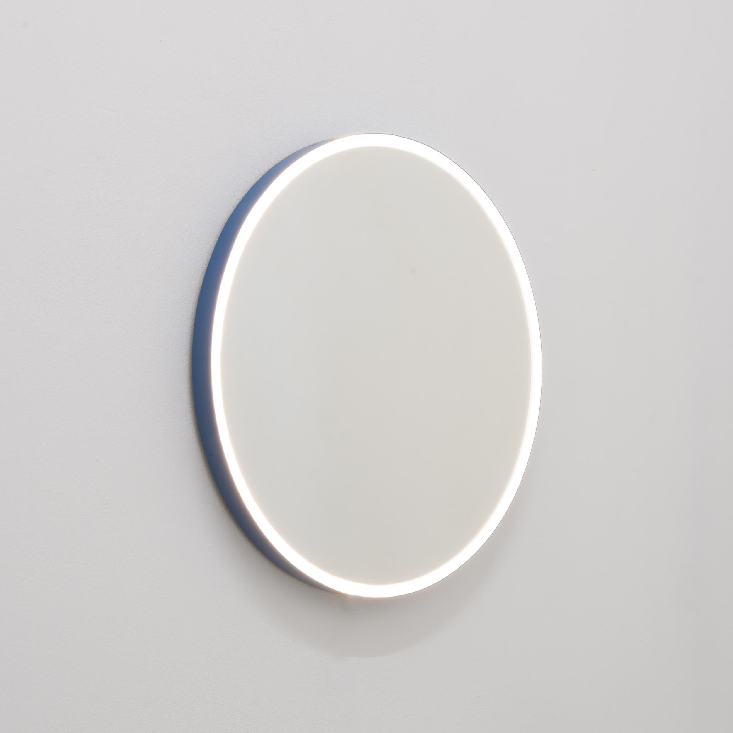 Charming round Orbis™ front Illuminated mirror with a modern powder coated blue frame (colour code RAL 5014) made to IP67 standard.

This mirror is fully customisable. It is illustrated with a warm light 3000K 14.4W/m, however the light temperature