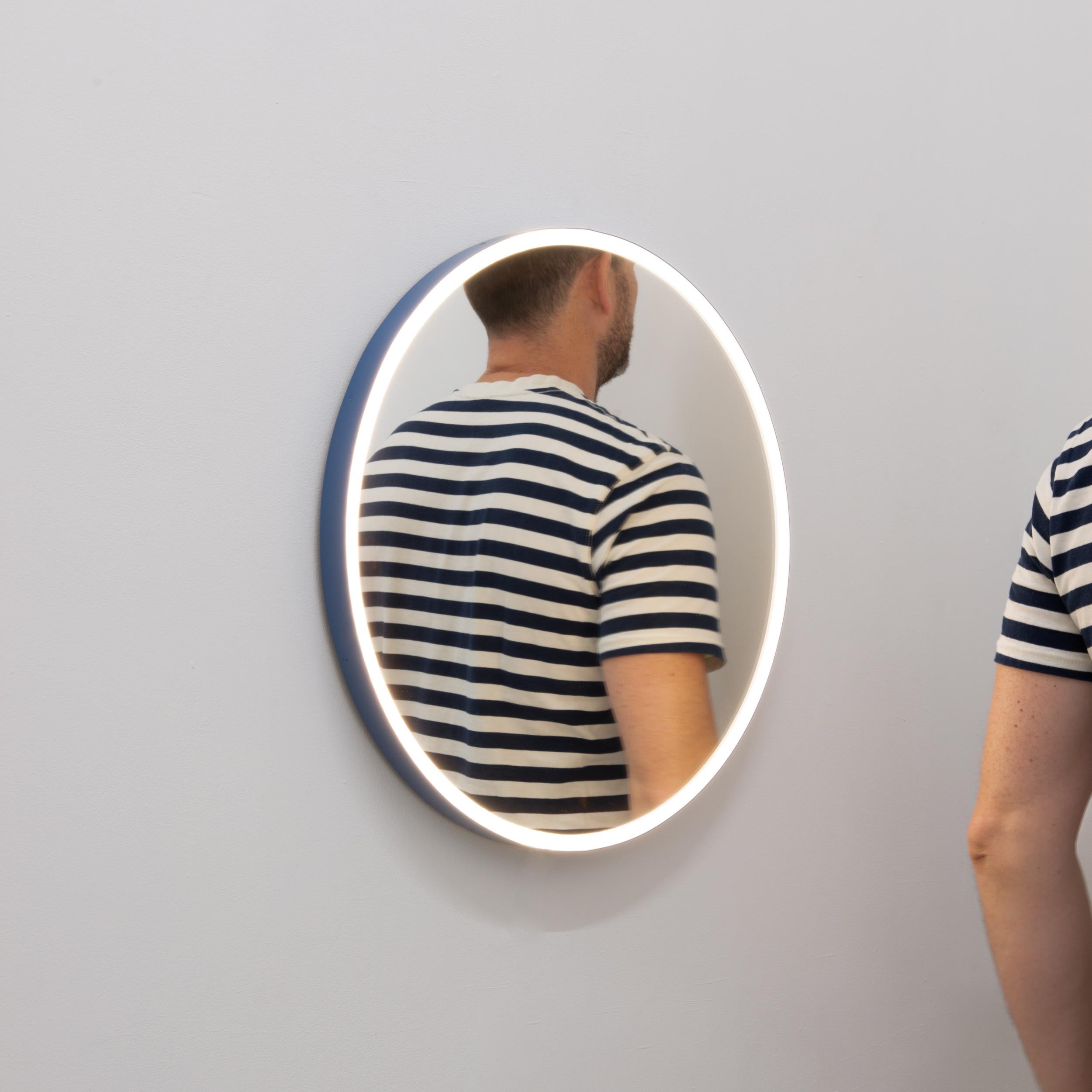 Contemporary Orbis™ front Illuminated round mirror with a modern powder coated blue frame. Designed and handcrafted in London, UK. This mirror is fully customisable to suit the specific requirements of each interior.

RAL colour powder coated frame.