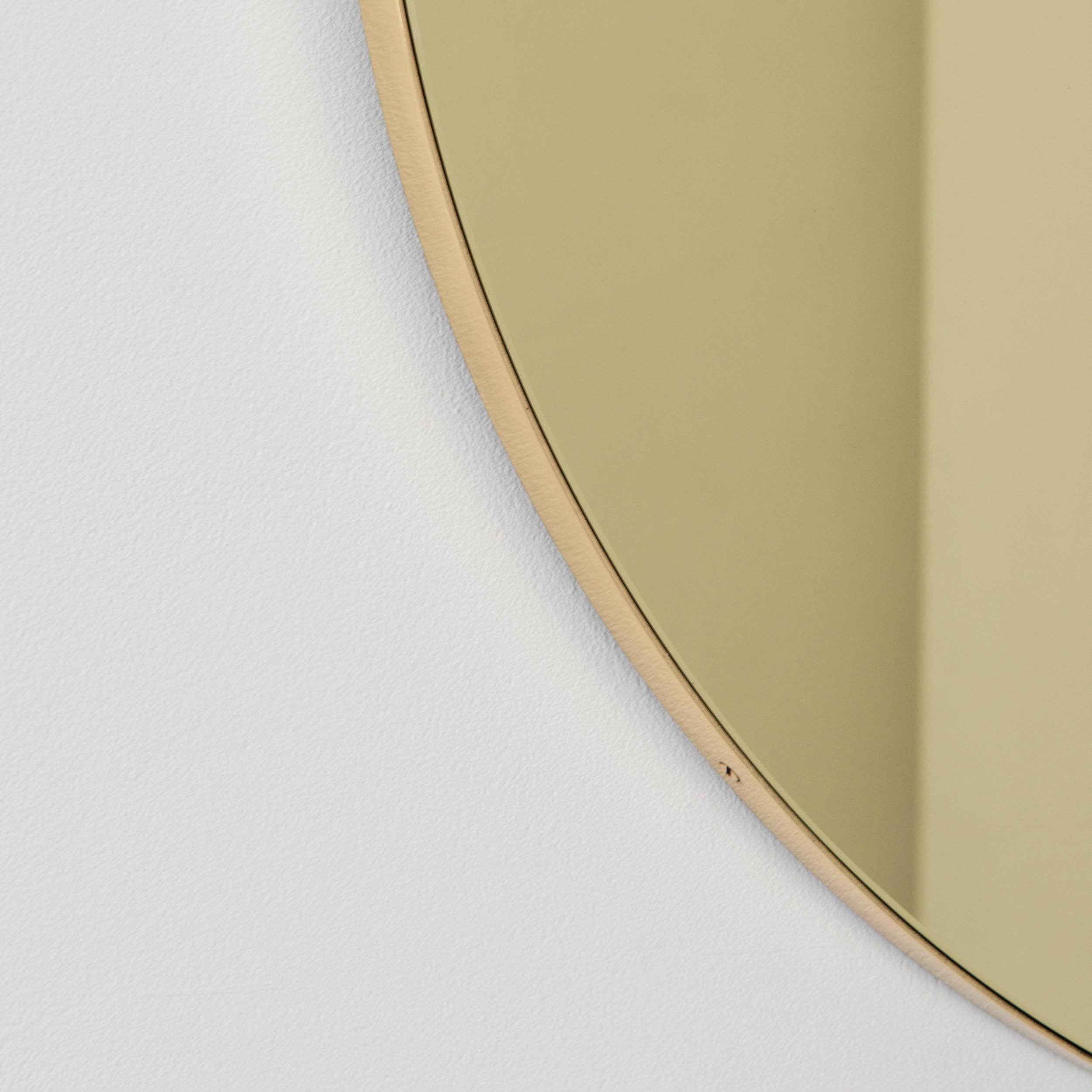 In Stock Orbis Gold Tinted Round Contemporary Mirror, Brass Frame, Medium For Sale 1