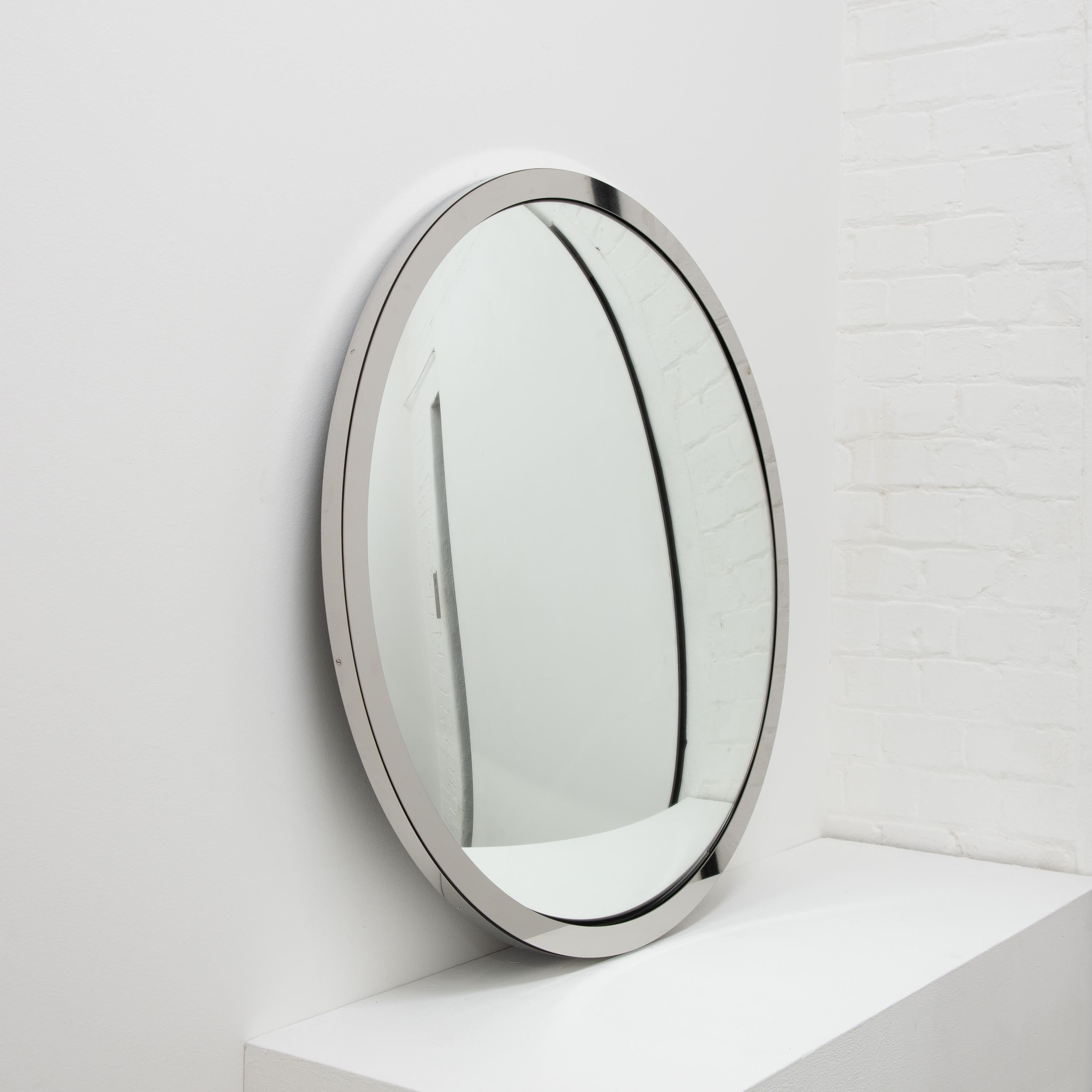 This item is available from stock and it may be packed and shipped within 5 working days from confirmation of order.

Stunning convex mirror with a polished stainless steel frame.

Each Orbis™ convex mirror is designed and handcrafted in London, UK.