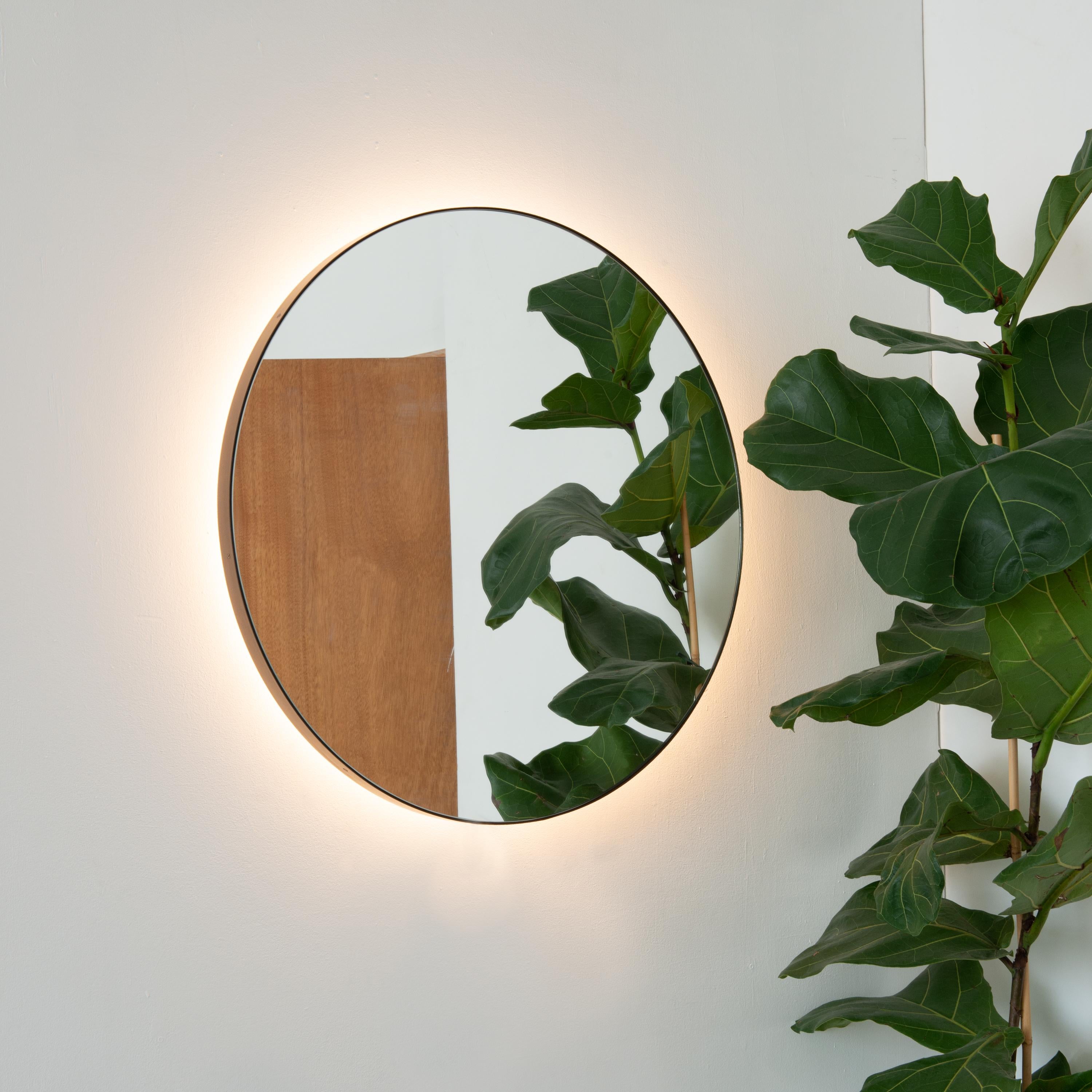In Stock Orbis Back Illuminated Round Modern Mirror, Bronze Patina Brass Frame In New Condition For Sale In London, GB
