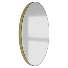 Grand miroir rond minimaliste Orbis avec cadre en laiton