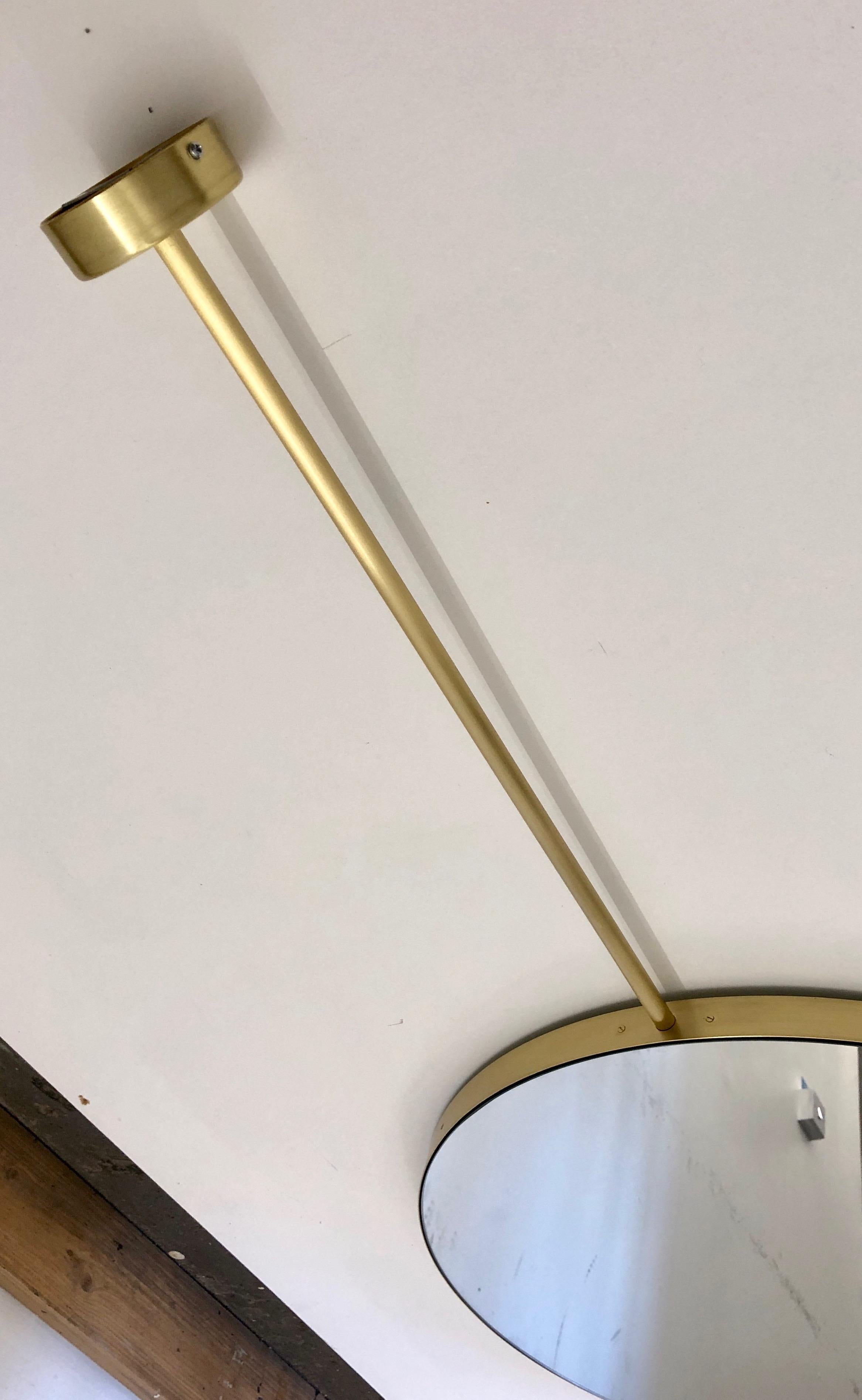 Beautiful suspended Orbis™ round double sided bathroom mirror with a brushed brass frame.

Dimensions: 140 x 55 x 3 cm / 55.2'' x 21.6'' x 1.2''

2 pieces available from stock.

For a bespoke size or finish allow 3 to 4 weeks of production time.