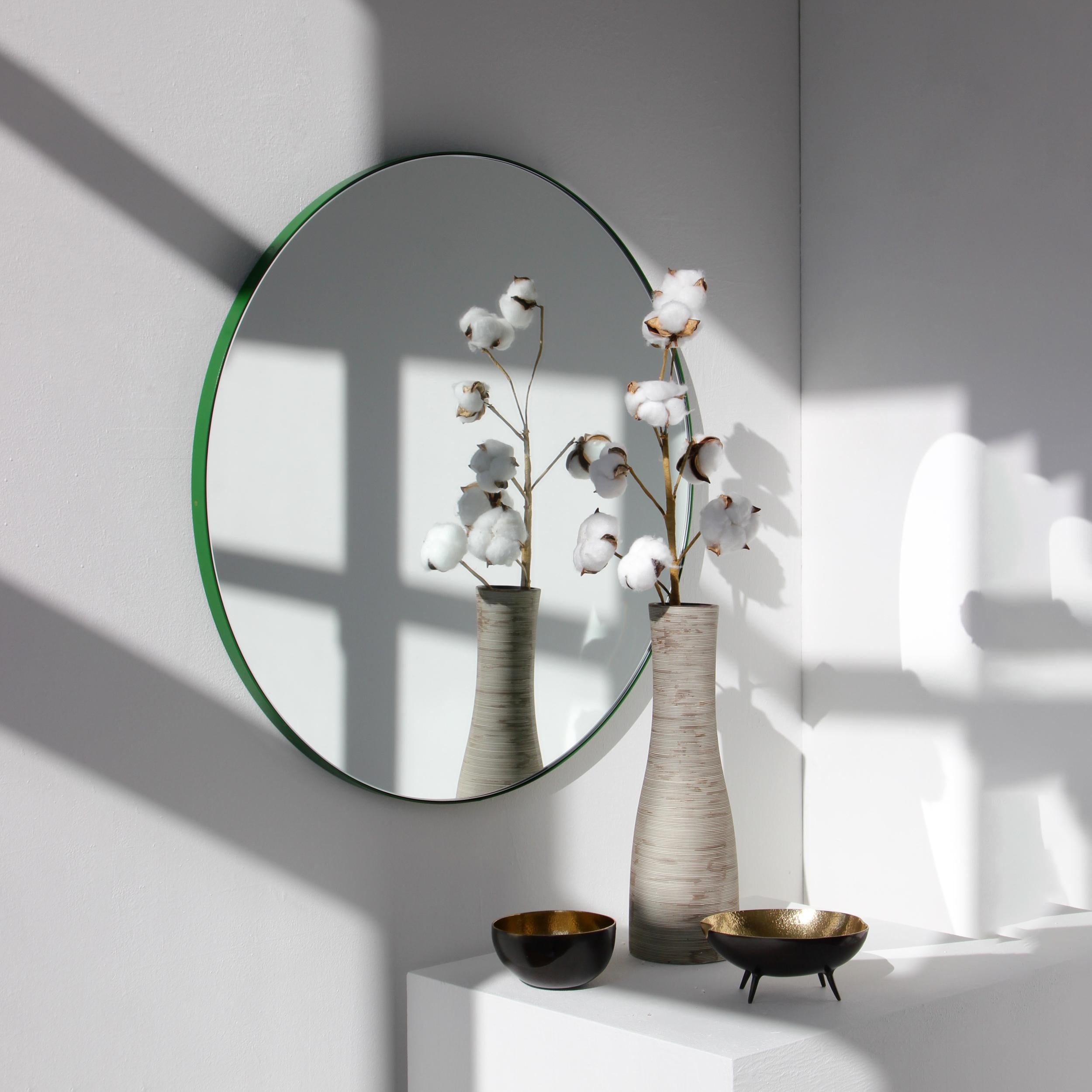 Minimalist round mirror with a lively aluminium powder coated green frame. Designed and handcrafted in London, UK.

Medium, large and extra-large mirrors (60, 80 and 100cm) are fitted with an ingenious French cleat (split batten) system so they may