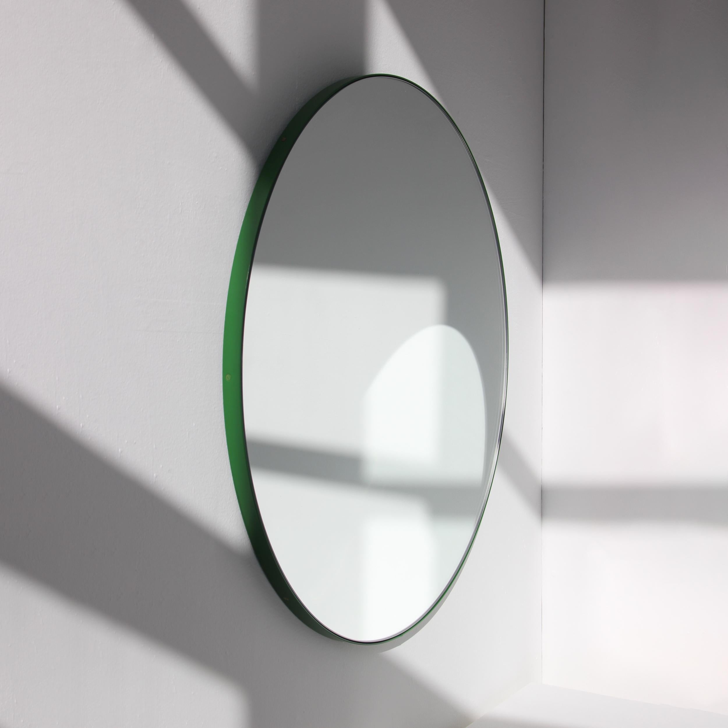 Minimalist round mirror with a lively aluminium powder coated green frame. Designed and handcrafted in London, UK.

Medium, large and extra-large mirrors (60, 80 and 100cm) are fitted with an ingenious French cleat (split batten) system so they may