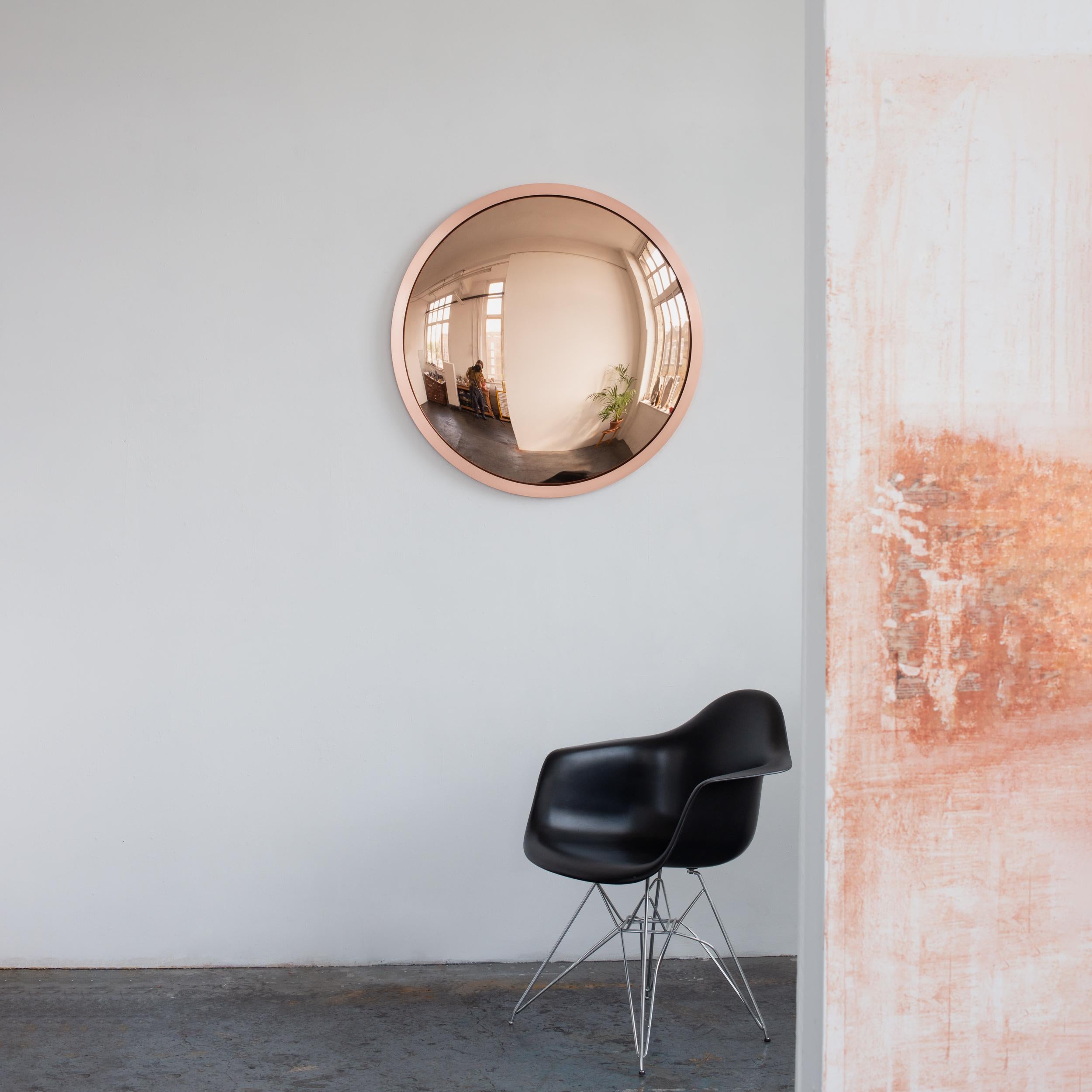 Stunning convex rose gold tinted mirror with a brushed copper frame.

Each Orbis™ convex mirror is designed and handcrafted in London, UK. Slight variations in sizes and imperfections on edges and surface finishes are characteristics of such