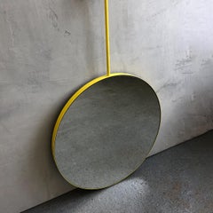 Orbis Suspended Round Mirror with a Modern Yellow Frame