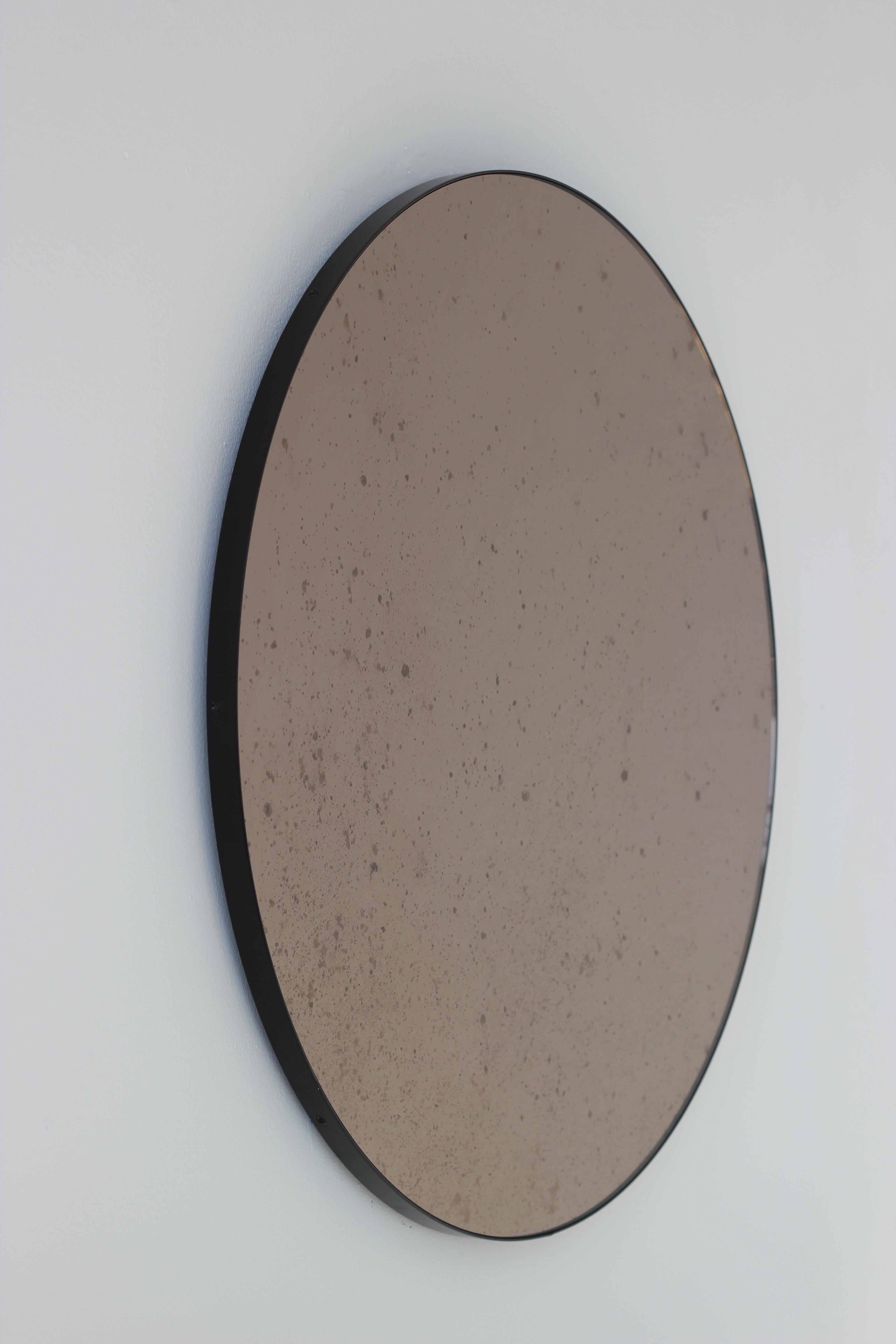 Orbis Antiqued Bronze Tinted Modern Round Mirror with a Black Frame, Regular In New Condition For Sale In London, GB