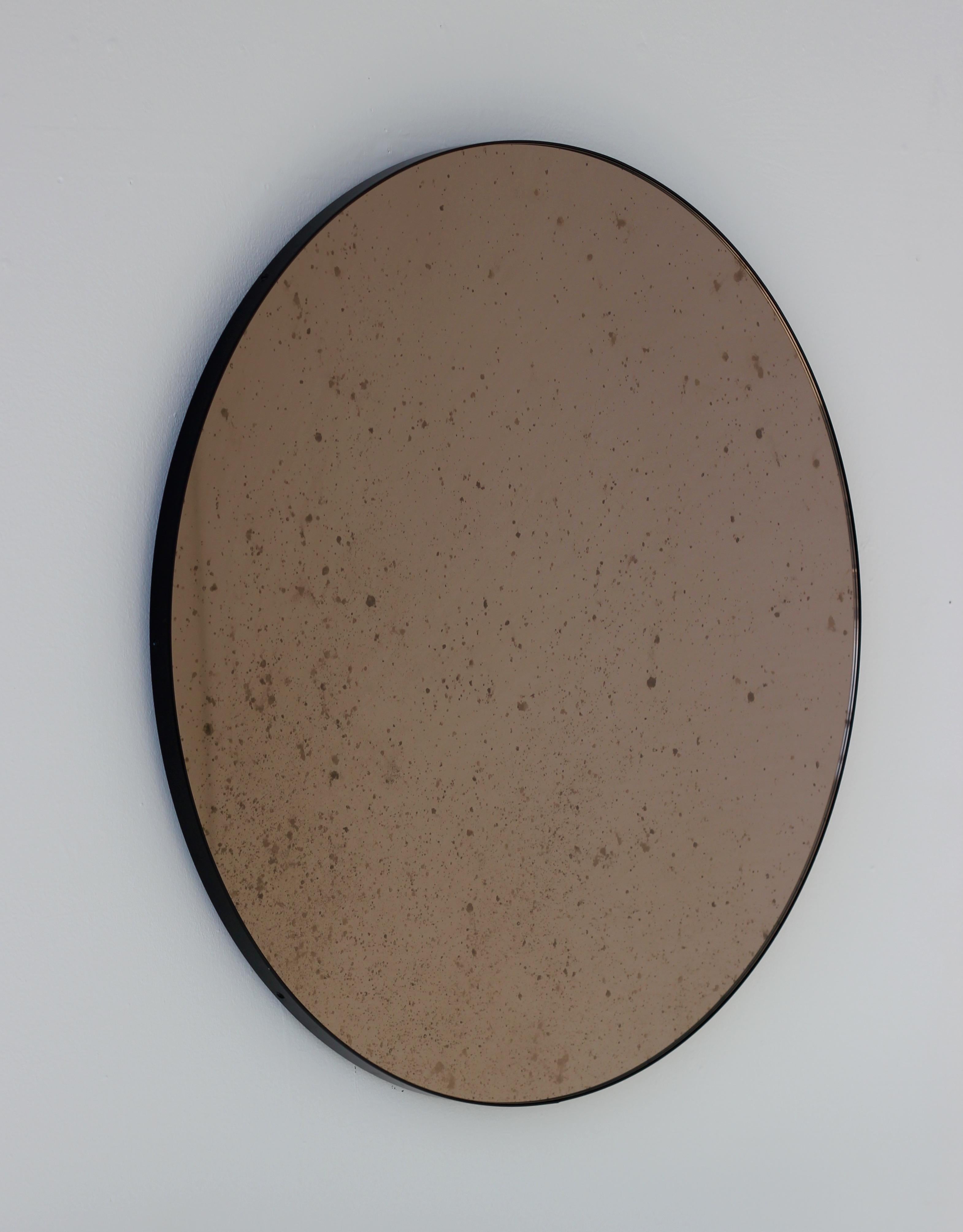 Organic Modern Orbis Round Antiqued Bronze Tinted Art Deco Mirror with a Black Frame, Small For Sale