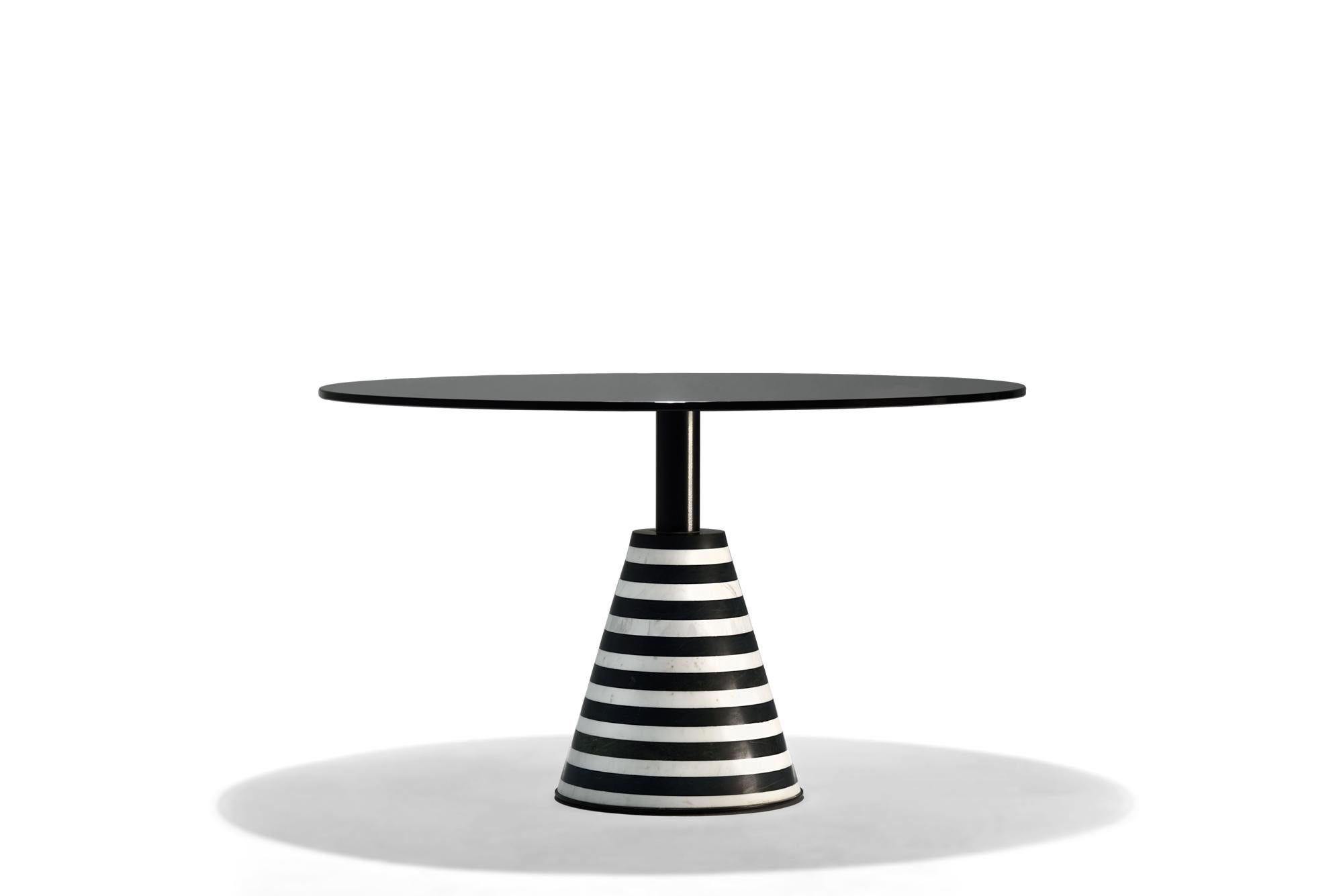 Beautifully round coffee tables showcase a black securit glass top based on a symmetrical striped black and white marble solid base. Crafted with a beautifully contemporary shape, can complement an array of interior design styles. Expertly hand
